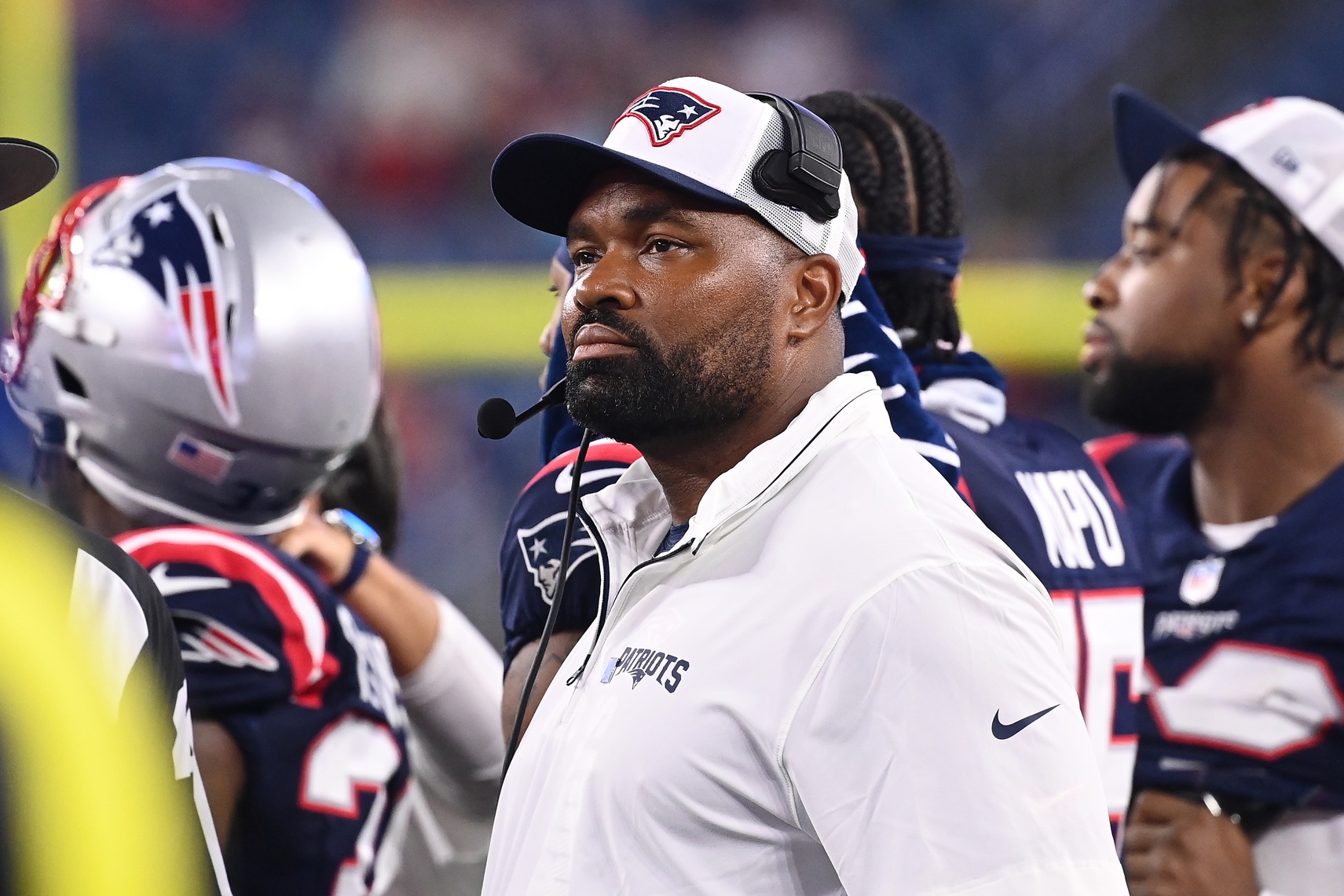 August 8, 2024; Foxborough, MA, USA;  New England Patriots head coach Jerod Mayo watches the video boards after challenging a call on the field during the second half against the Carolina Panthers at Gillette Stadium. Mandatory Credit: Eric Canha-USA TODAY Sports
