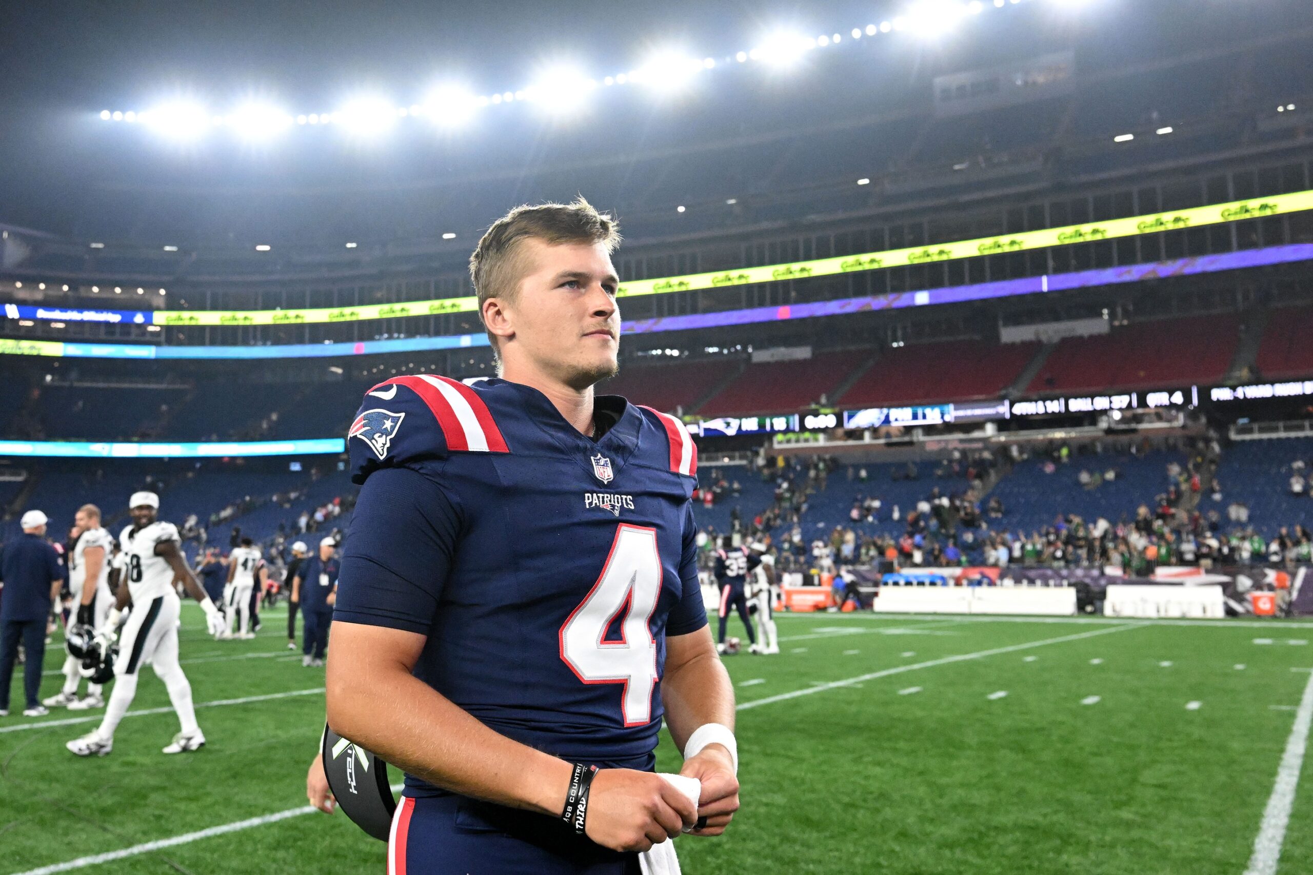 Aug 15, 2024; Foxborough, Massachusetts, USA; New England Patriots quarterback Bailey Zappe (4) walks off of the field after a game against the Philadelphia Eagles during the second half at Gillette Stadium. Mandatory Credit: Brian Fluharty-USA TODAY Sports