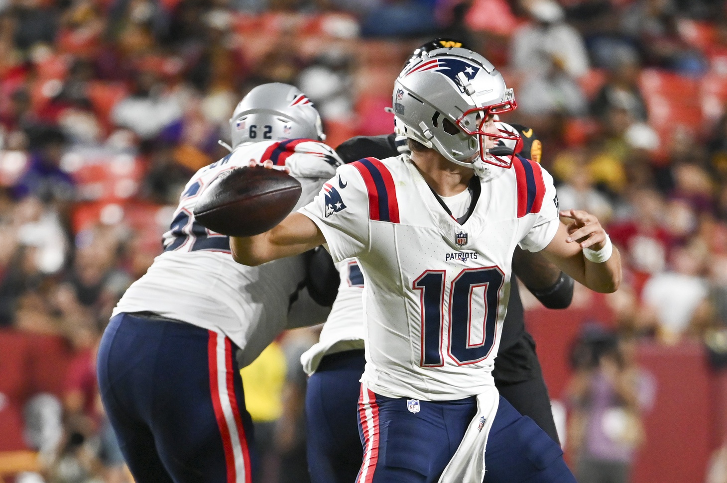 Aug 25, 2024; Landover, Maryland, USA; New England Patriots quarterback Drake Maye (10) throws  during the first half against the Washington Commanders at Commanders Field. Mandatory Credit: Tommy Gilligan-USA TODAY Sports
