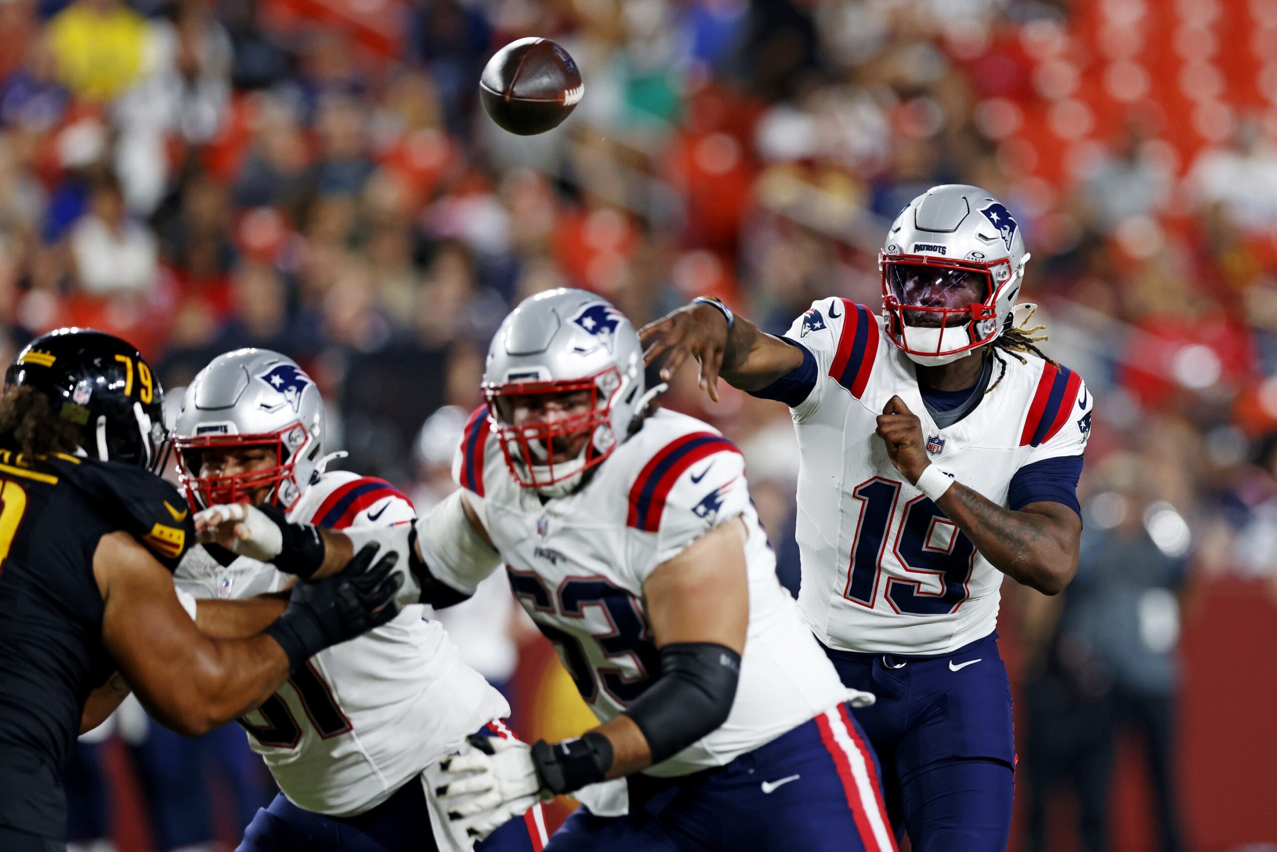 Aug 25, 2024; Landover, Maryland, USA; New England Patriots quarterback Joe Milton III (19) throws a pass during the third quarter against the Washington Commanders during a preseason game at Commanders Field. Mandatory Credit: Peter Casey-USA TODAY Sports