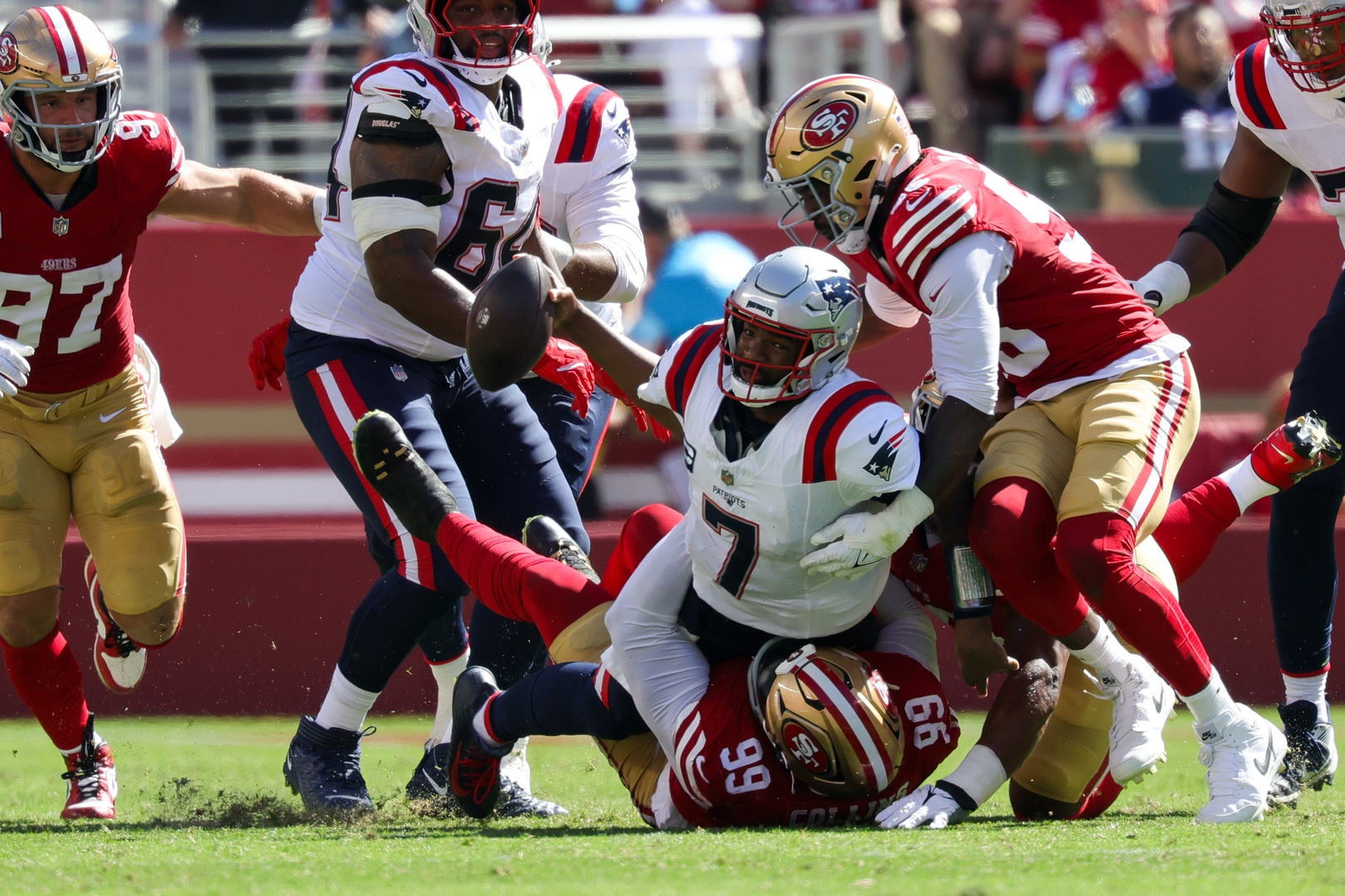 Sep 29, 2024; Santa Clara, California, USA; New England Patriots quarterback Jacoby Brissett (7) is sacked by San Francisco 49ers defensive tackle Maliek Collins (99) during the second quarter at Levi's Stadium. Mandatory Credit: Sergio Estrada-Imagn Images