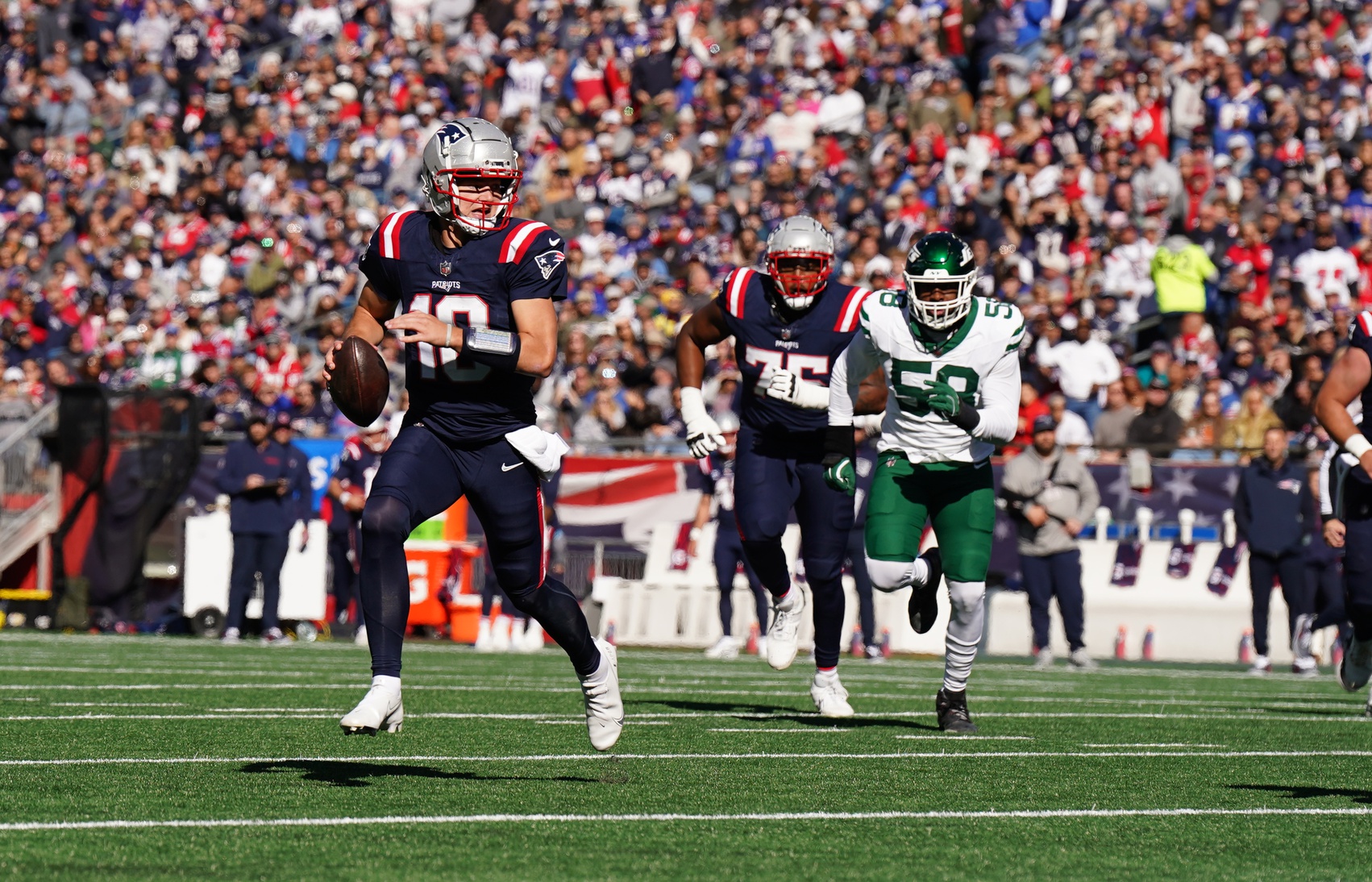 Oct 27, 2024; Foxborough, Massachusetts, USA; New England Patriots quarterback Drake Maye (10) runs the ball for a touchdown against the New York Jets in the first quarter at Gillette Stadium. Mandatory Credit: David Butler II-Imagn Images