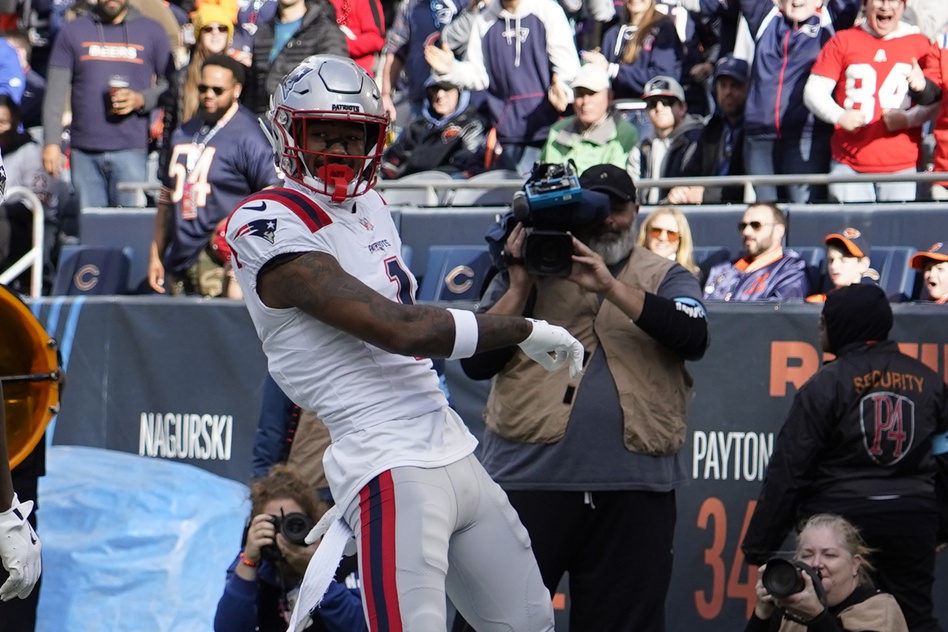 Nov 10, 2024; Chicago, Illinois, USA; New England Patriots wide receiver Ja'Lynn Polk (1) celebrates after catching a touchdown pass against the Chicago Bears during the first half at Soldier Field. Mandatory Credit: David Banks-Imagn Images