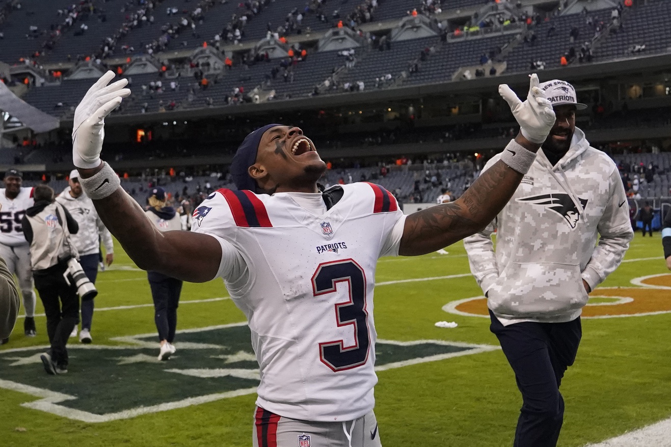 Nov 10, 2024; Chicago, Illinois, USA; New England Patriots wide receiver DeMario Douglas (3) celebrates the win against the Chicago Bears at Soldier Field. Mandatory Credit: David Banks-Imagn Images
