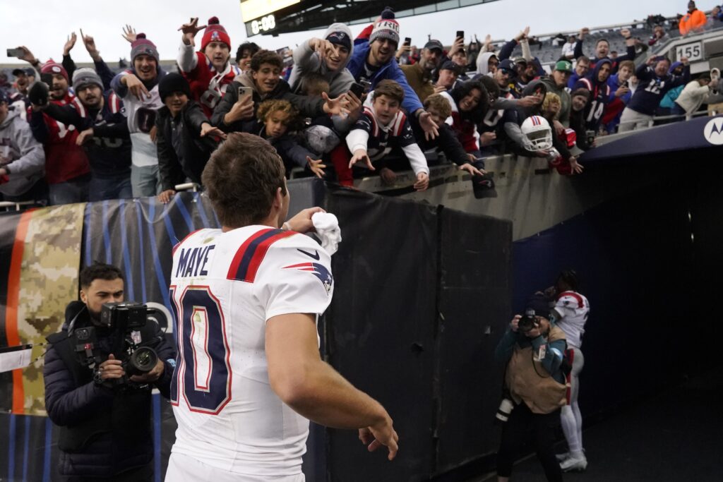 Nov 10, 2024; Chicago, Illinois, USA; New England Patriots quarterback Drake Maye (10) celebrates the win against the Chicago Bears at Soldier Field. Mandatory Credit: David Banks-Imagn Images