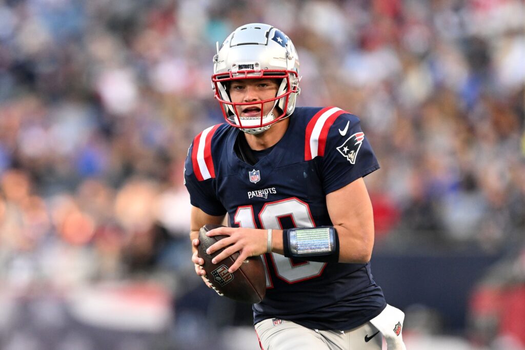 Nov 17, 2024; Foxborough, Massachusetts, USA; New England Patriots quarterback Drake Maye (10) runs with the ball against the Los Angeles Rams during the second half at Gillette Stadium. Mandatory Credit: Brian Fluharty-Imagn Images