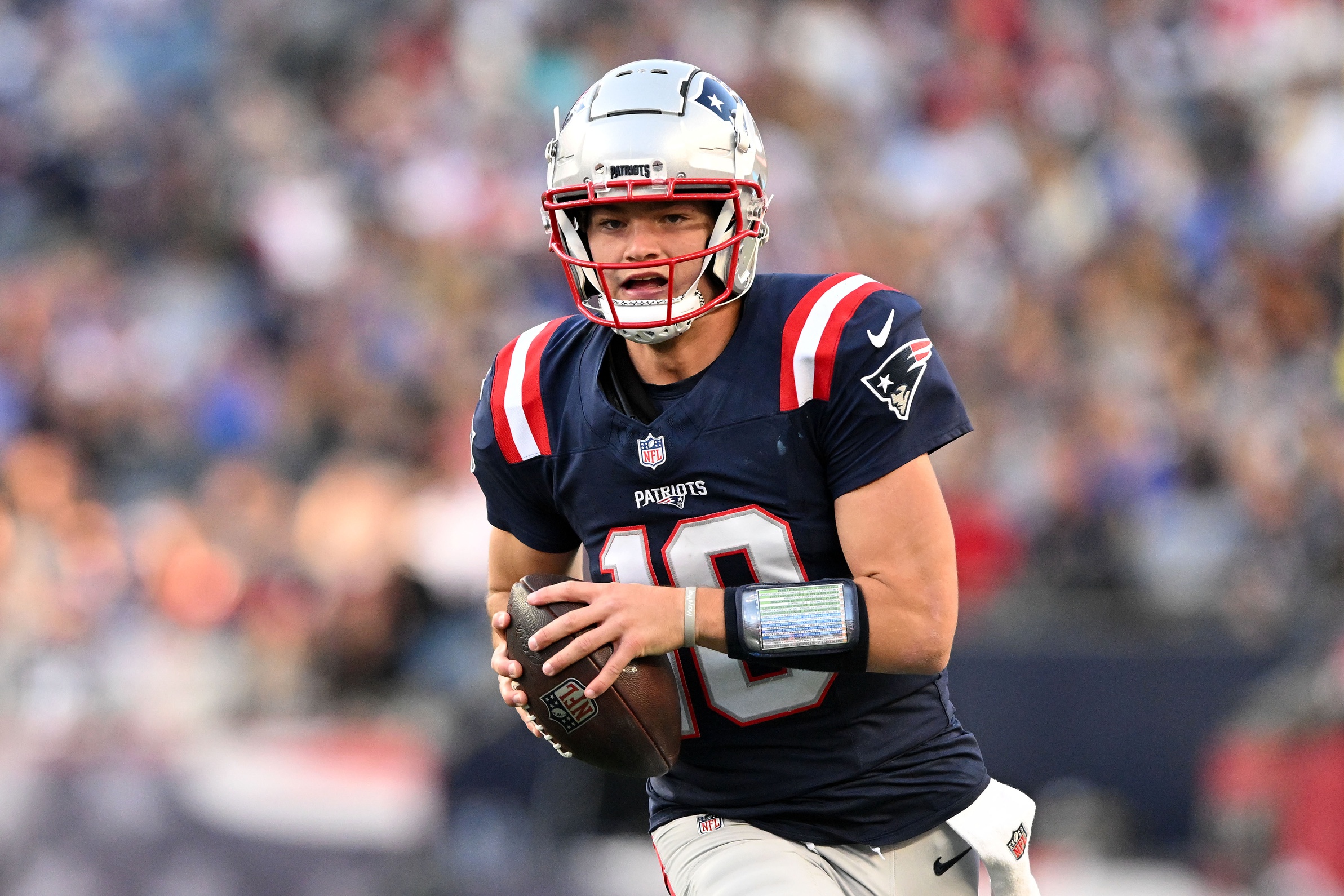 Nov 17, 2024; Foxborough, Massachusetts, USA; New England Patriots quarterback Drake Maye (10) runs with the ball against the Los Angeles Rams during the second half at Gillette Stadium. Mandatory Credit: Brian Fluharty-Imagn Images