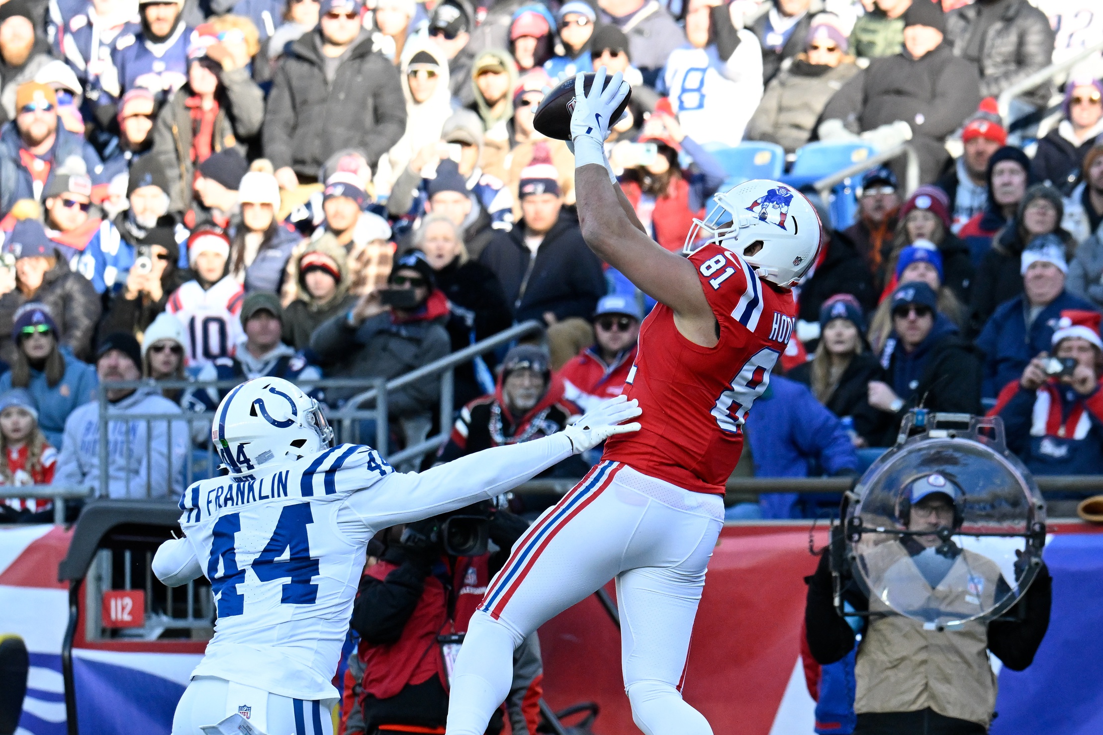 Dec 1, 2024; Foxborough, Massachusetts, USA; New England Patriots tight end Austin Hooper (81) makes a catch for a touchdown  against the Indianapolis Colts during the first half at Gillette Stadium. Mandatory Credit: Eric Canha-Imagn Images