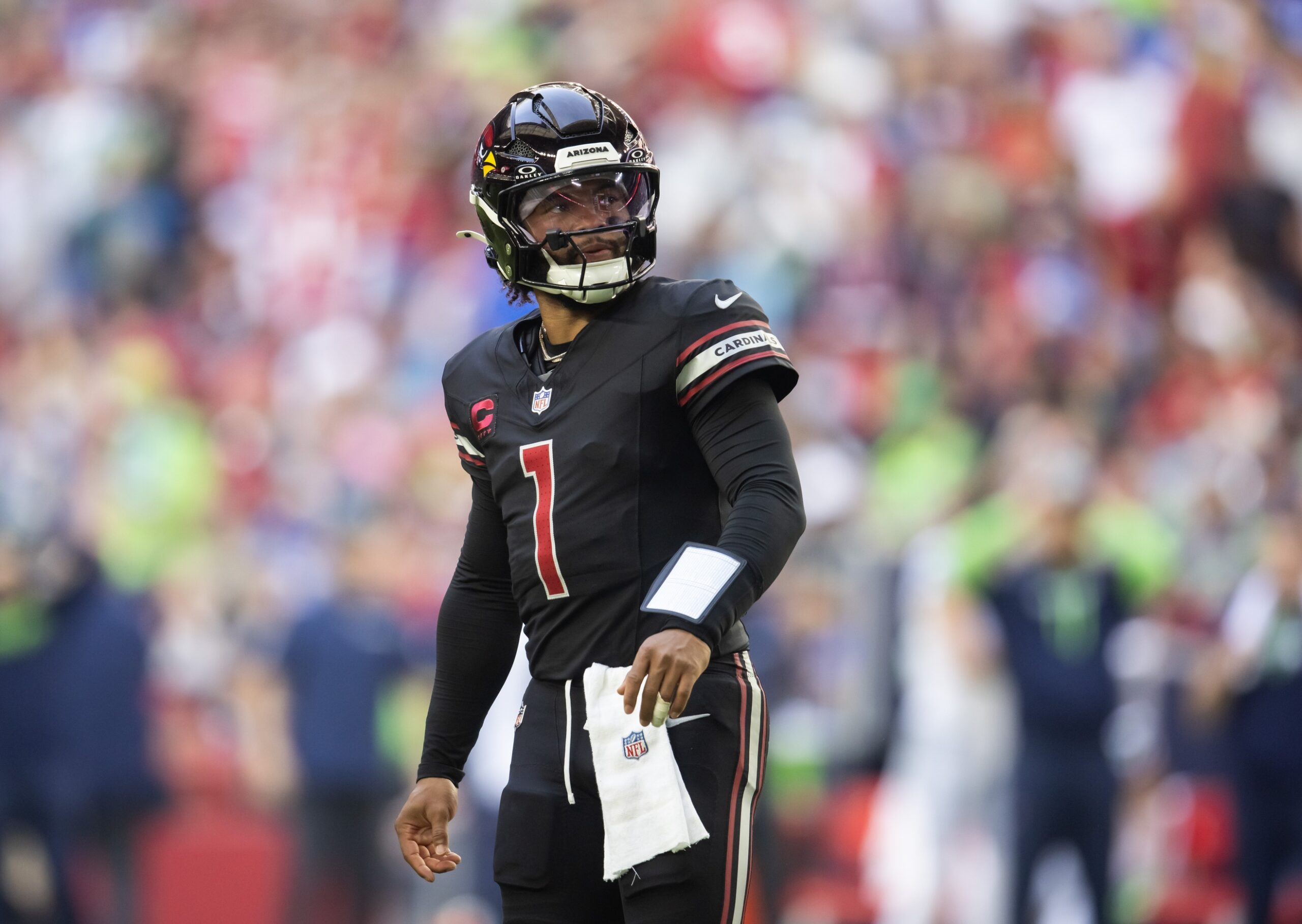 Dec 8, 2024; Glendale, Arizona, USA; Arizona Cardinals quarterback Kyler Murray (1) against the Seattle Seahawks in the first half at State Farm Stadium. Mandatory Credit: Mark J. Rebilas-Imagn Images