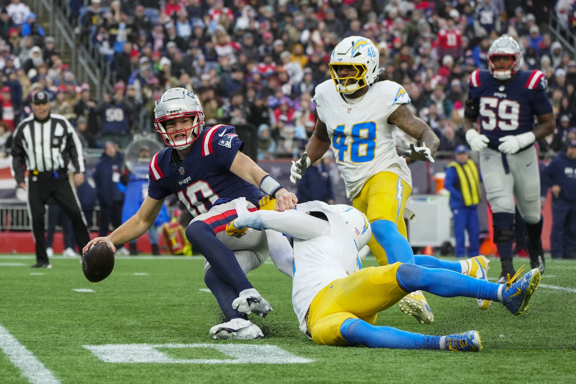 Dec 28, 2024; Foxborough, Massachusetts, USA; Los Angeles Chargers safety Derwin James Jr. (3) sacks New England Patriots quarterack Drake Maye (10) during the second half at Gillette Stadium. Mandatory Credit: Gregory Fisher-Imagn Images