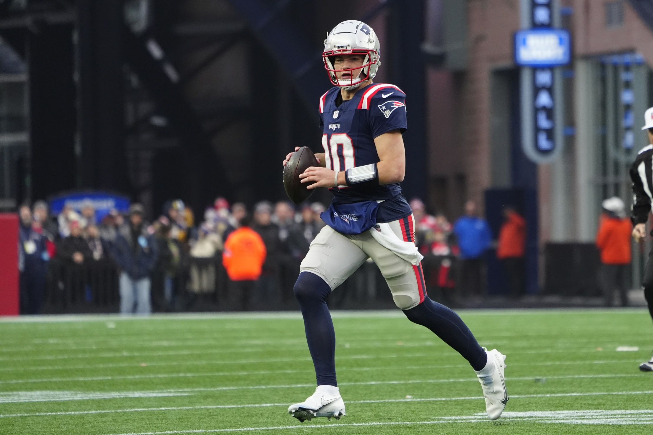 Dec 28, 2024; Foxborough, Massachusetts, USA; New England Patriots quarterack Drake Maye (10) runs with the ball against the Los Angeles Chargers during the second half at Gillette Stadium. Mandatory Credit: Gregory Fisher-Imagn Images