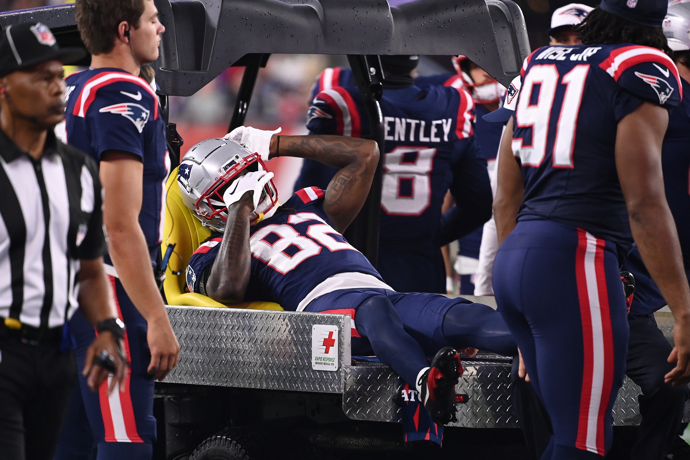 Aug 15, 2024; Foxborough, MA, USA; New England Patriots wide receiver JaQuae Jackson (82) is carted off the field during the second half against the Philadelphia Eagles at Gillette Stadium. Mandatory Credit: Eric Canha-USA TODAY Sports