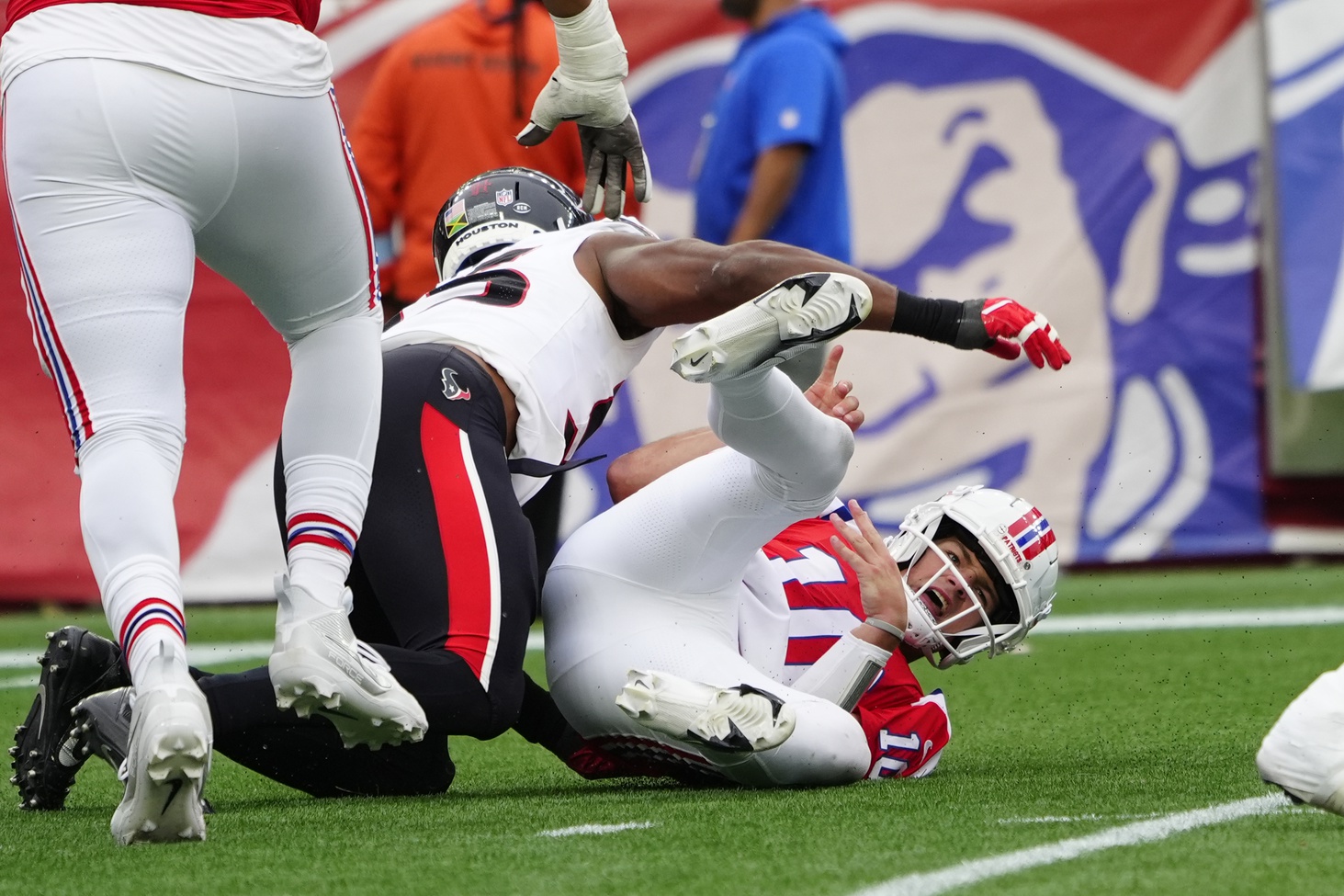 Oct 13, 2024; Foxborough, Massachusetts, USA; New England Patriots quarterback Drake Maye (10) is sacked by Houston Texans defensive end Danielle Hunter (55) and fumbles the ball during the second half at Gillette Stadium. Mandatory Credit: Gregory Fisher-Imagn Images