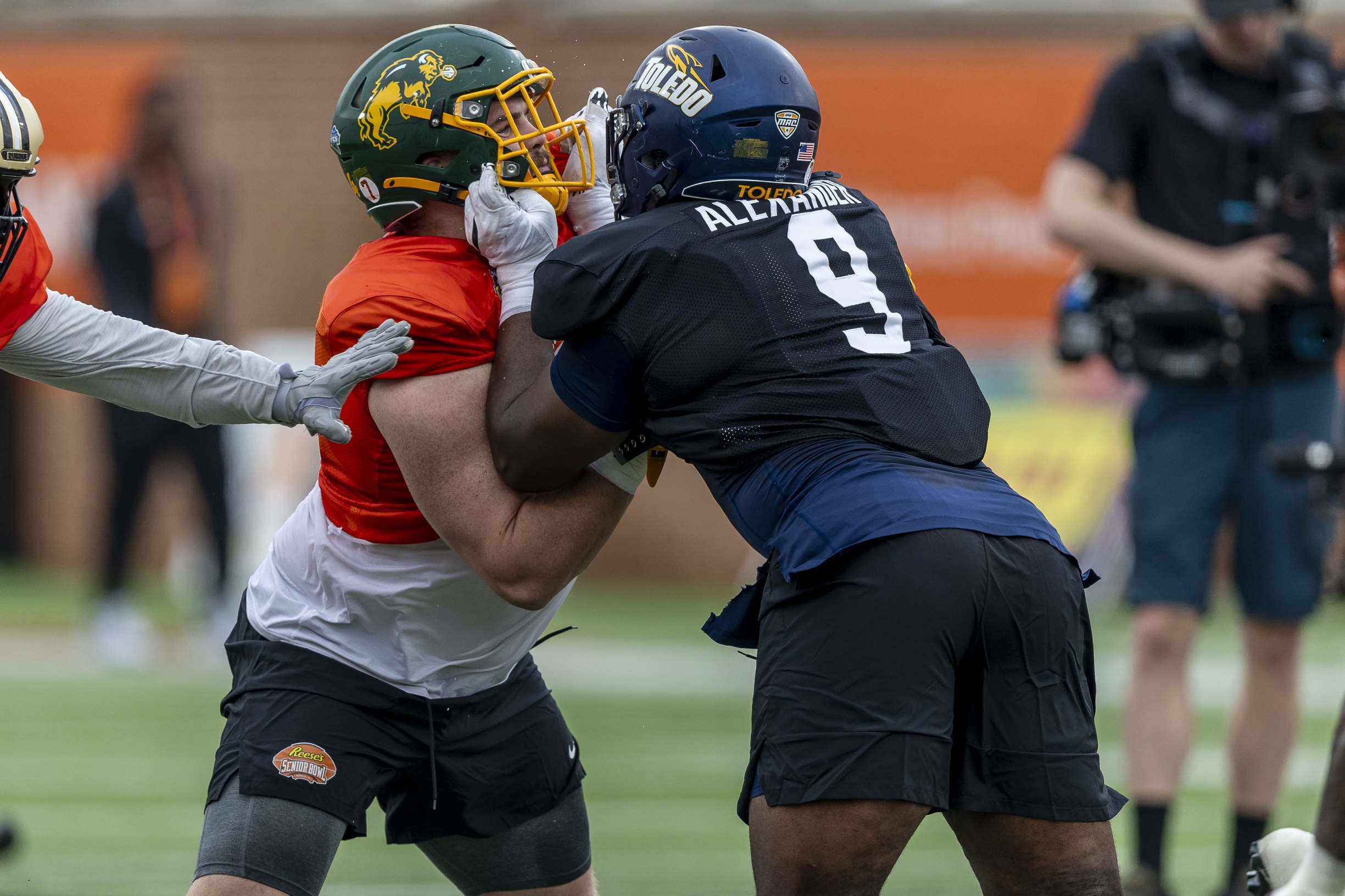 Jan 30, 2025; Mobile, AL, USA; National team offensive lineman Grey Zabel of North Dakota State (77) works against National team defensive lineman Darius Alexander of Toledo (9) during Senior Bowl practice for the National team at Hancock Whitney Stadium. Mandatory Credit: Vasha Hunt-Imagn Images
