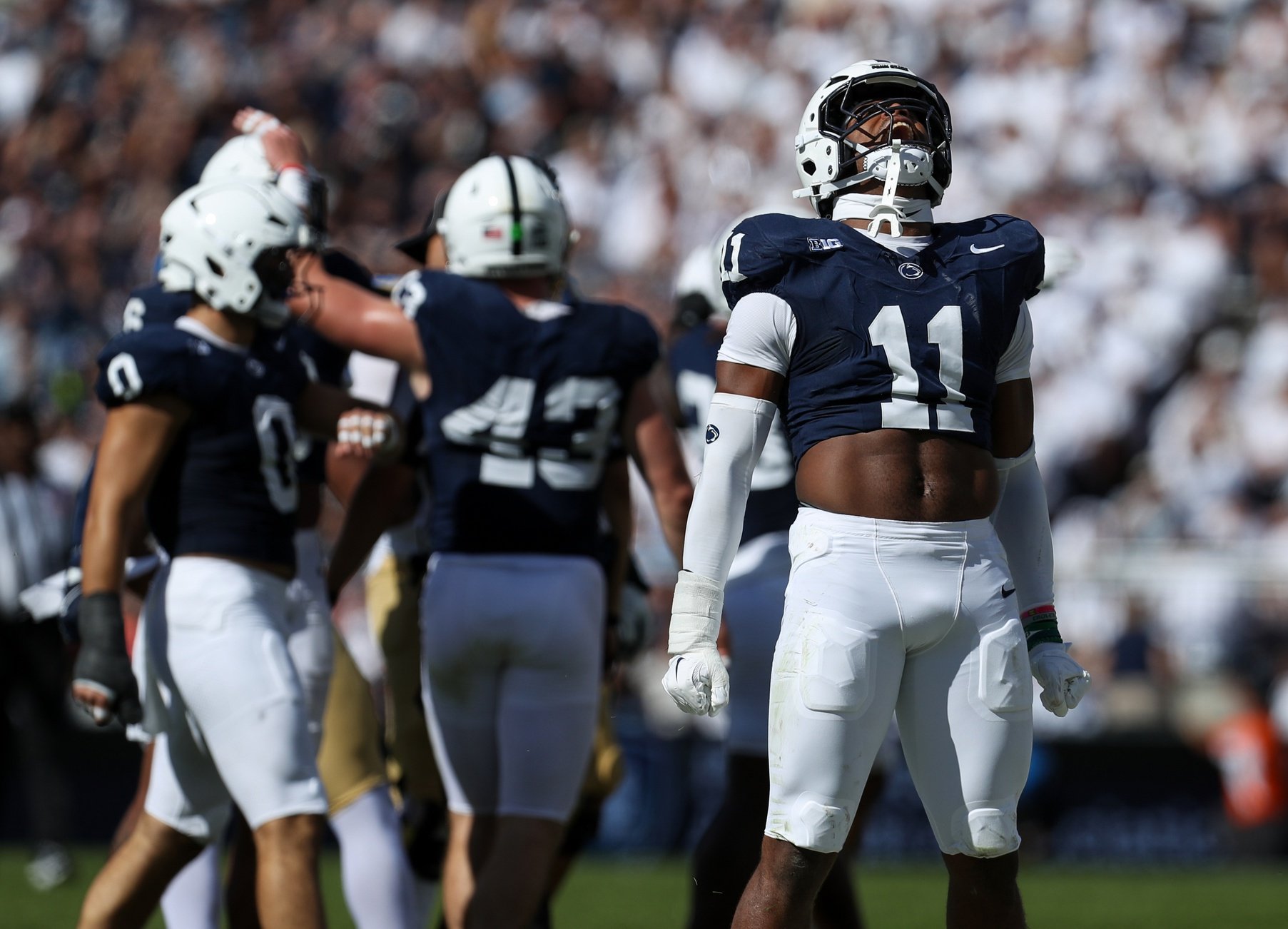 Oct 5, 2024; University Park, Pennsylvania, USA; Penn State Nittany Lions defensive end Abdul Carter (11) reacts after tackling UCLA Bruins running back Jalen Berger (0) during the third quarter at Beaver Stadium. Mandatory Credit: Matthew O'Haren-Imagn Images