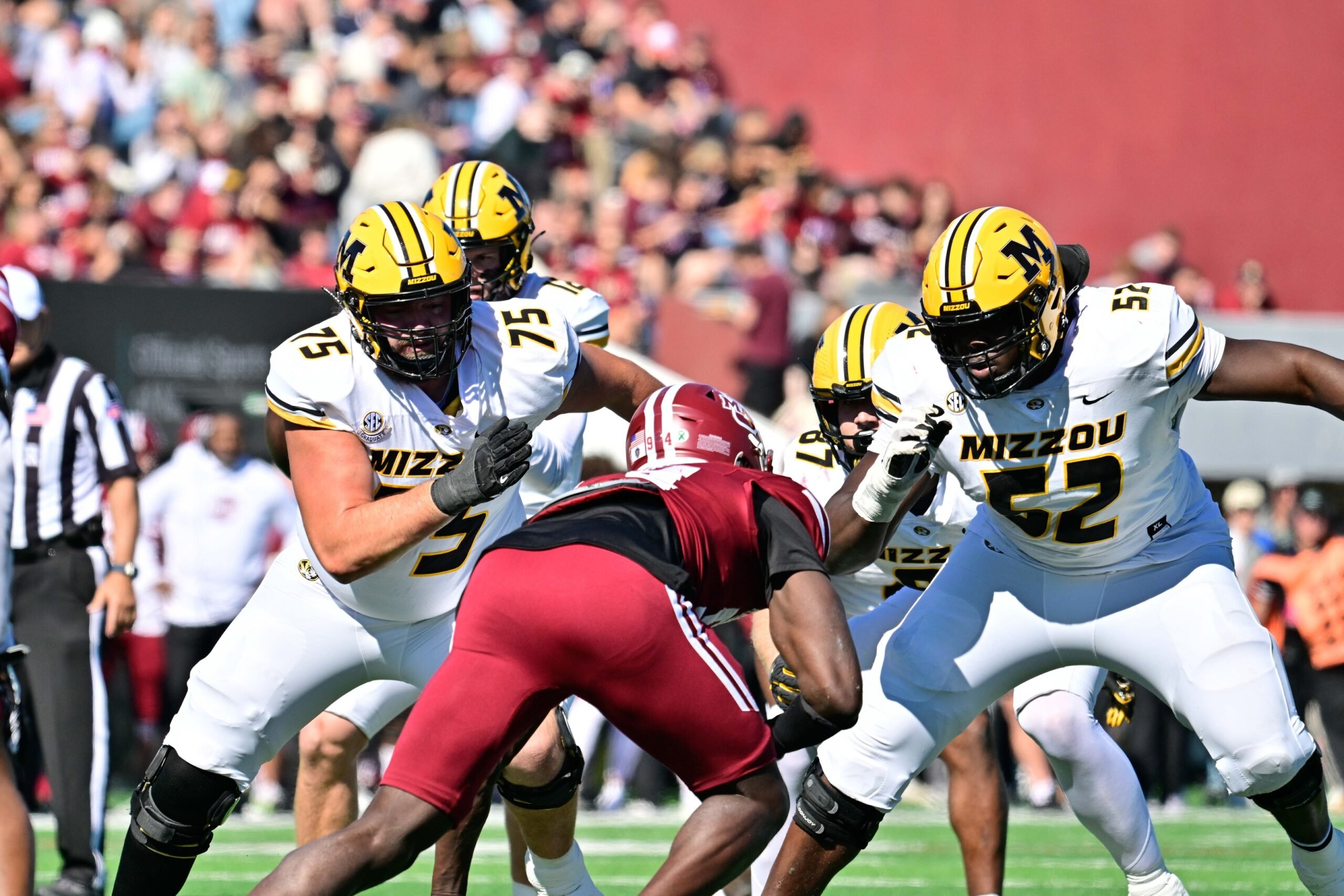 Oct 12, 2024; Amherst, Massachusetts, USA; Missouri Tigers offensive lineman Mitchell Walters (75) and offensive lineman Marcus Bryant (52)  blocking Massachusetts Minutemen defensive end Kofi Asare (94) during the first half at Warren McGuirk Alumni Stadium. Mandatory Credit: Eric Canha-Imagn Images