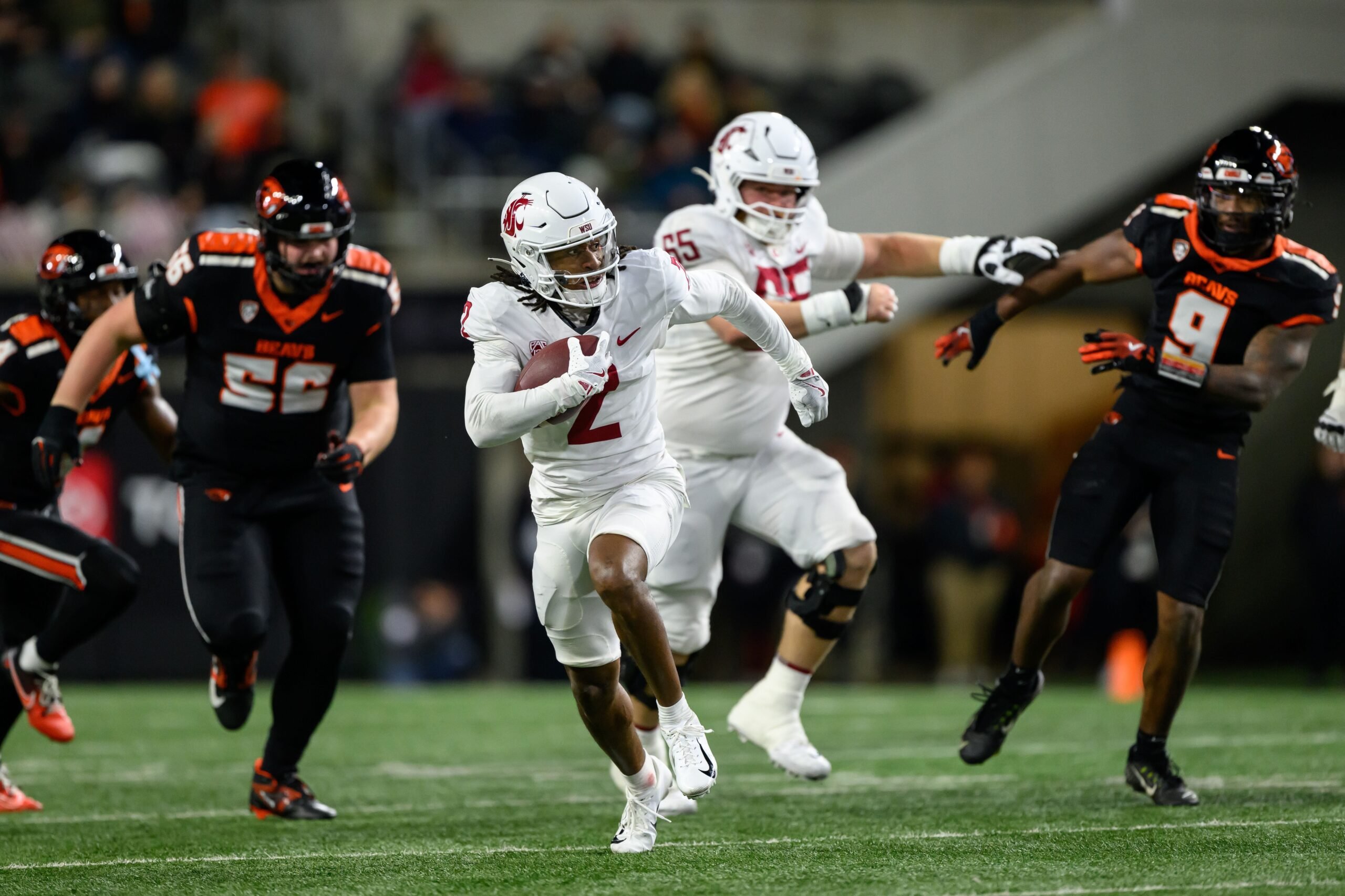 Nov 23, 2024; Corvallis, Oregon, USA; Washington State Cougars wide receiver Kyle Williams (2) runs the ball for a touchdown during the third quarter against the Oregon State Beavers at Reser Stadium. Mandatory Credit: Craig Strobeck-Imagn Images