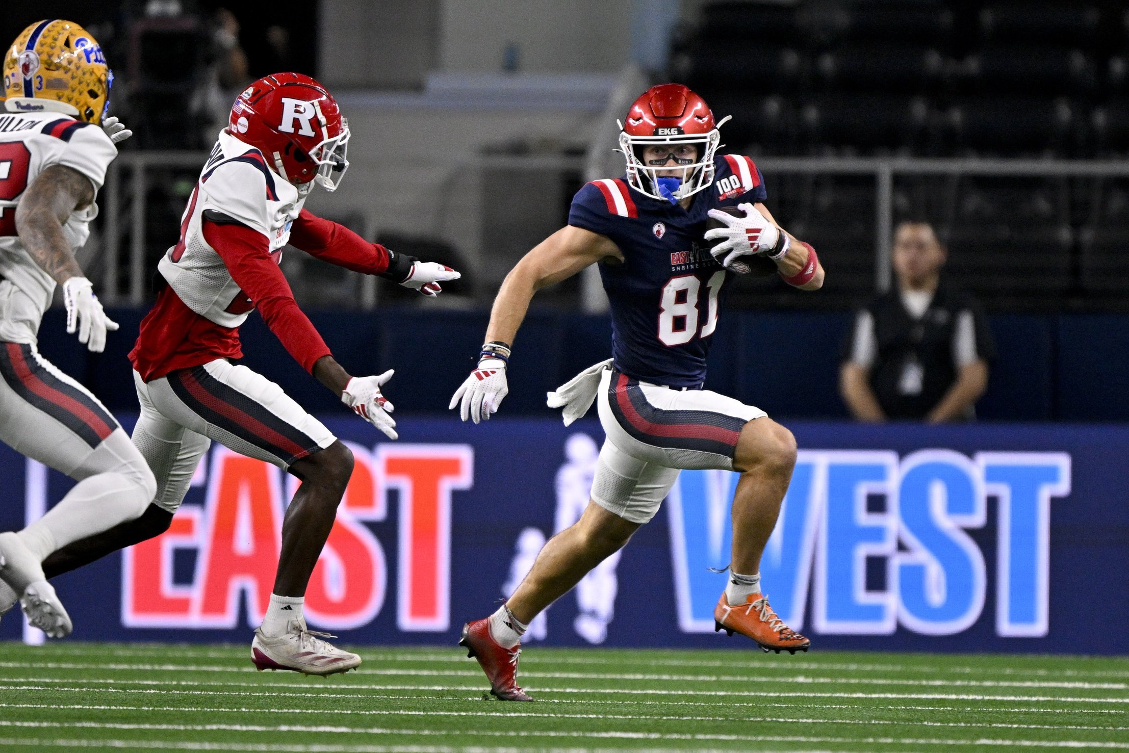 Jan 30, 2025; Arlington, TX, USA; East wide receiver Efton Chism of Eastern Washington (81) eludes West defensive back Robert Longerbeam of Rutgers (20) during the first half at AT&T Stadium. Mandatory Credit: Jerome Miron-Imagn Images