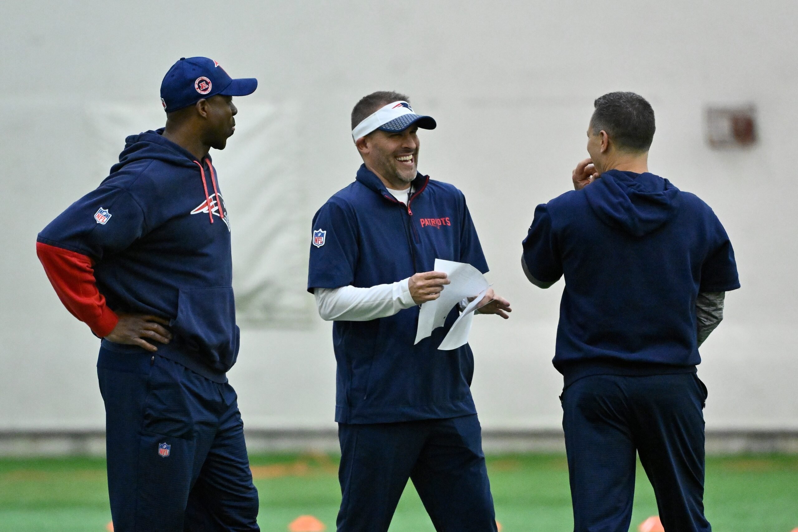 May 9, 2025; Foxborough, MA, USA; New England Patriots offensive coordinator Josh McDaniels (c) talks to coaching staff at rookie camp at Gillette Stadium. Mandatory Credit: Eric Canha-Imagn Images