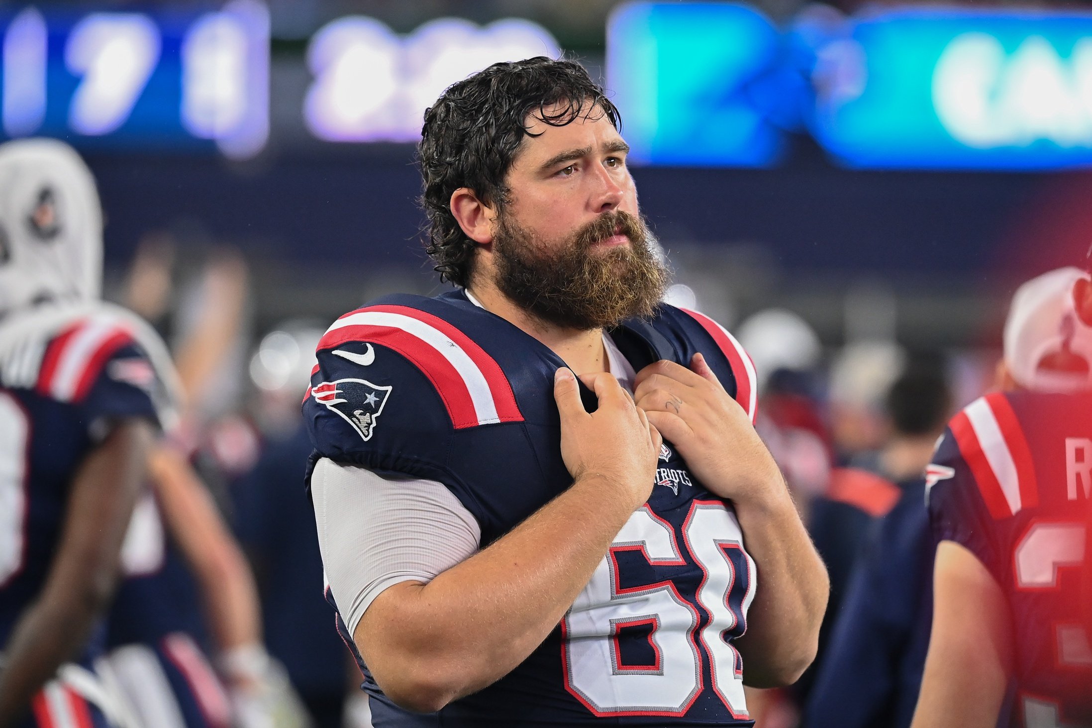 August 8, 2024; Foxborough, MA, USA;  New England Patriots center David Andrews (60) watches from the sideline during the first half against the Carolina Panthers at Gillette Stadium. Mandatory Credit: Eric Canha-USA TODAY Sports