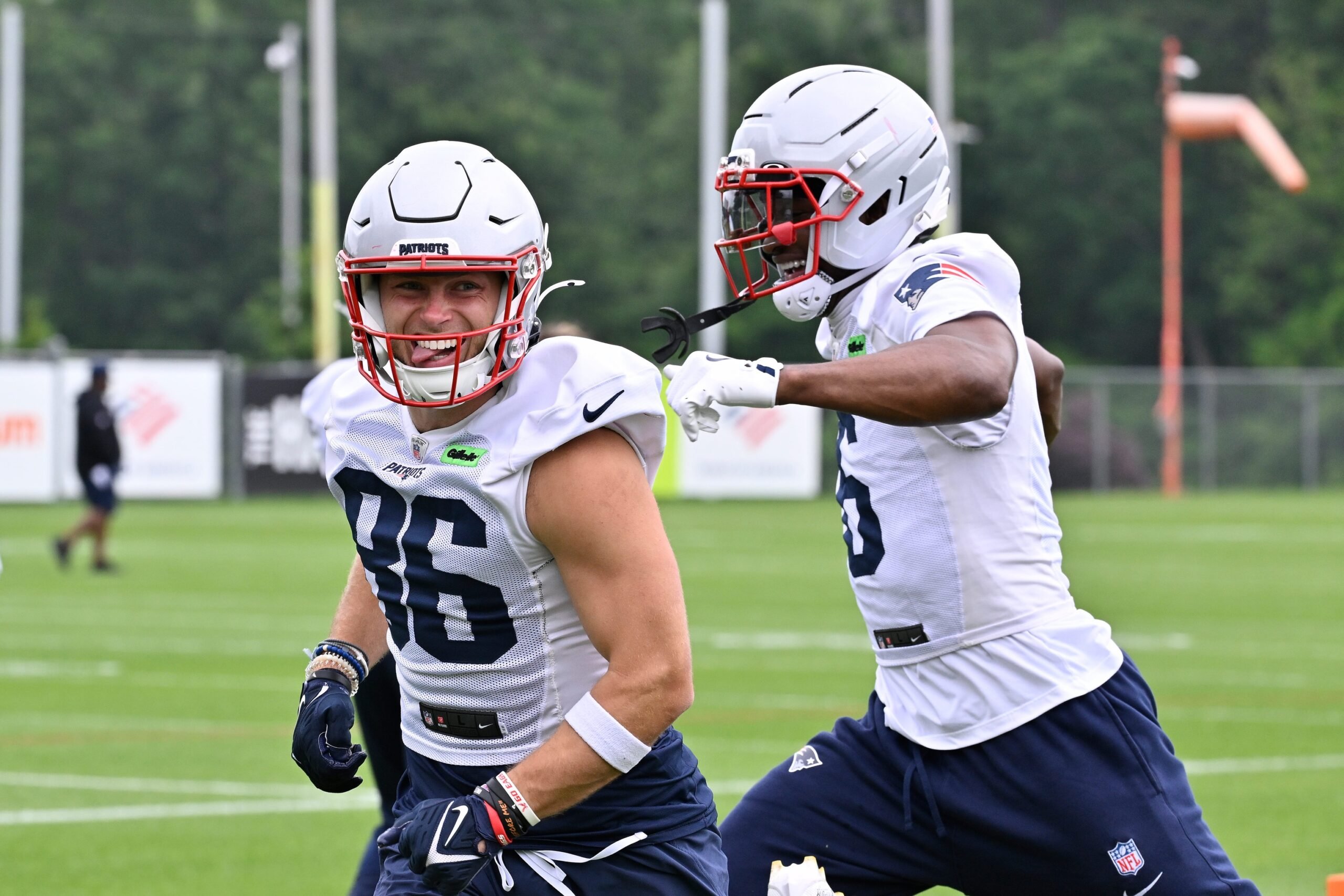 Jun 9, 2025; Foxborough, MA, USA; New England Patriots wide receiver Efton Chism III (86) reacts to beating wide receiver Javon Baker (6) in a drill during minicamp at Gillette Stadium. Mandatory Credit: Eric Canha-Imagn Images