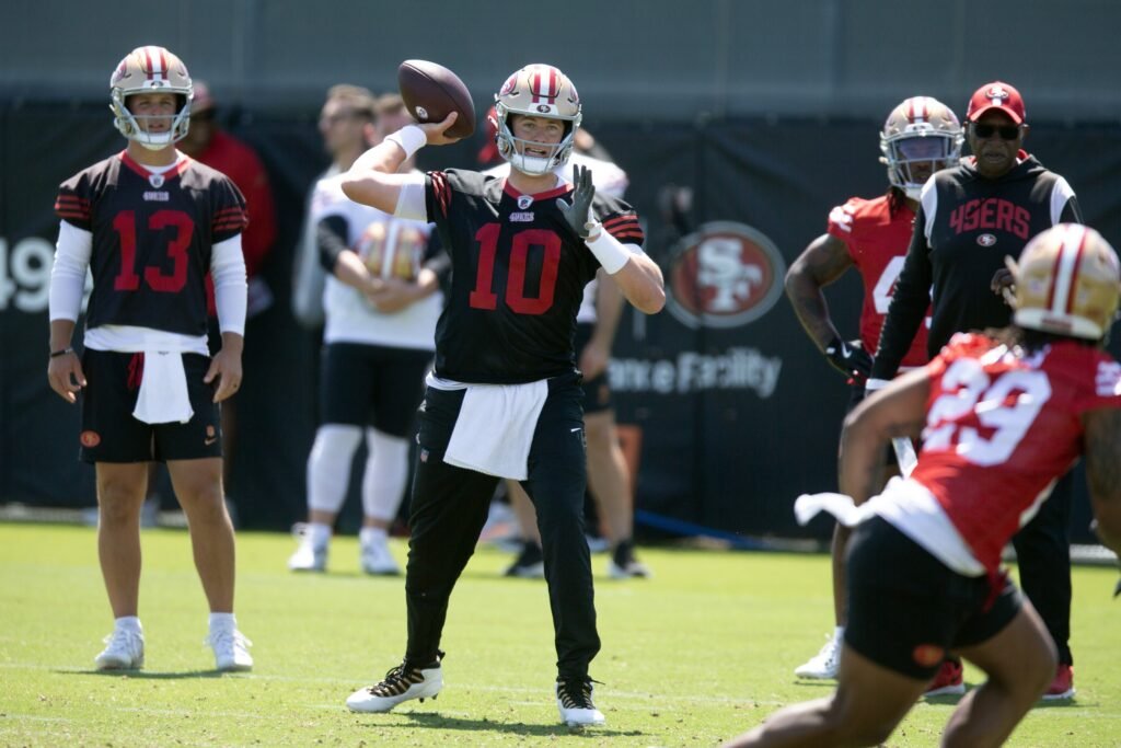 Jun 10, 2025; Santa Clara, CA, USA; San Francisco 49ers quarterback Mac Jones (10) participates in a passing drill during an OTA at Levi's Stadium. Mandatory Credit: D. Ross Cameron-Imagn Images