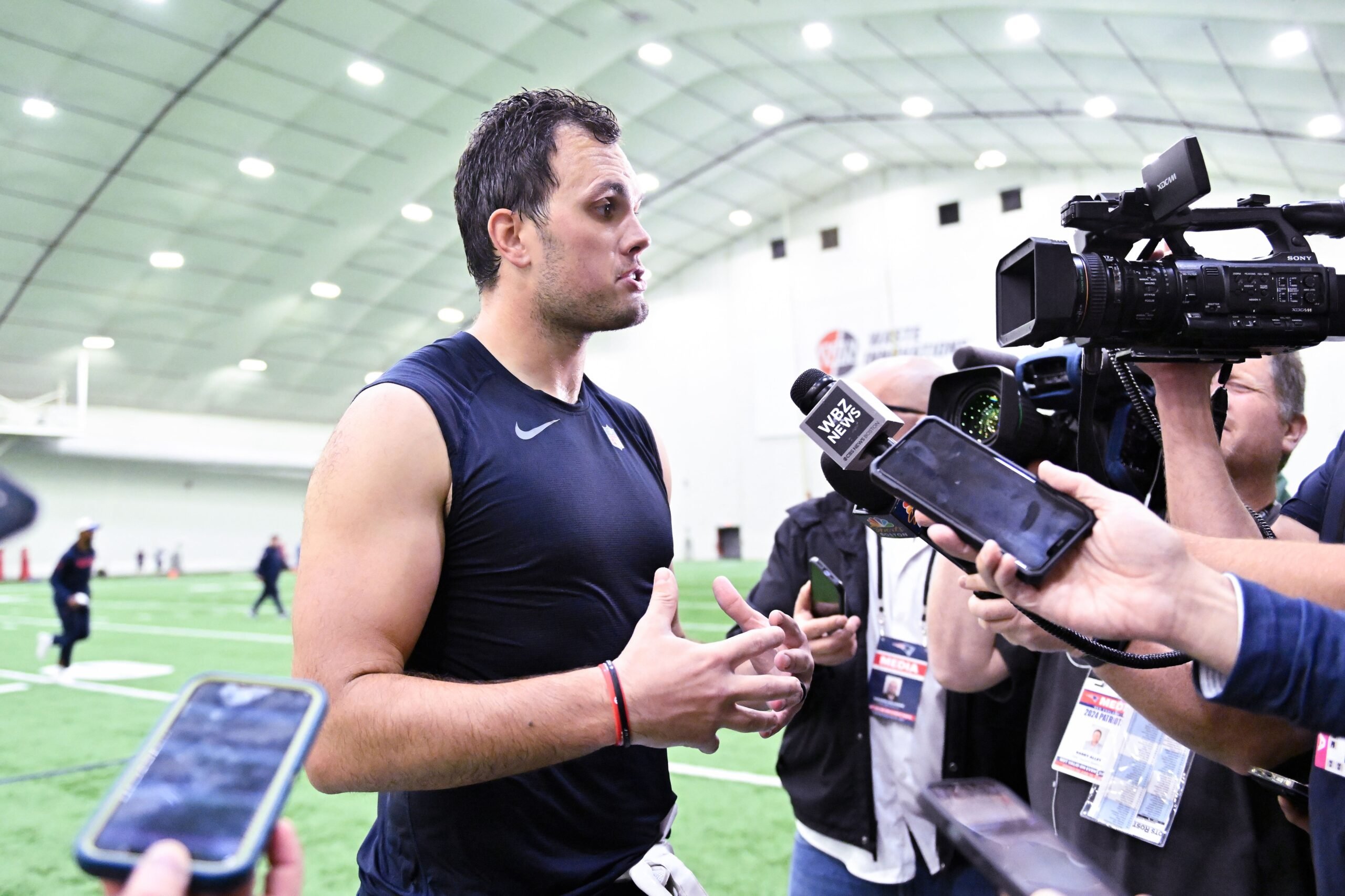 Jun 10, 2025; Foxborough, MA, USA; New England Patriots tight end Hunter Henry (85) speaks to the media after minicamp held in the WIN Field House at Gillette Stadium. Mandatory Credit: Eric Canha-Imagn Images
