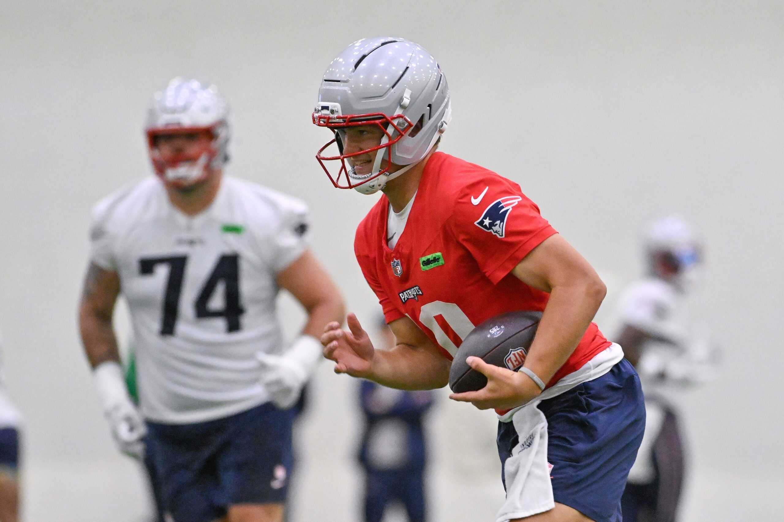 Jun 10, 2025; Foxborough, MA, USA; New England Patriots quarterback Drake Maye (10) runs the ball during minicamp held in the WIN Field House at Gillette Stadium. Mandatory Credit: Eric Canha-Imagn Images