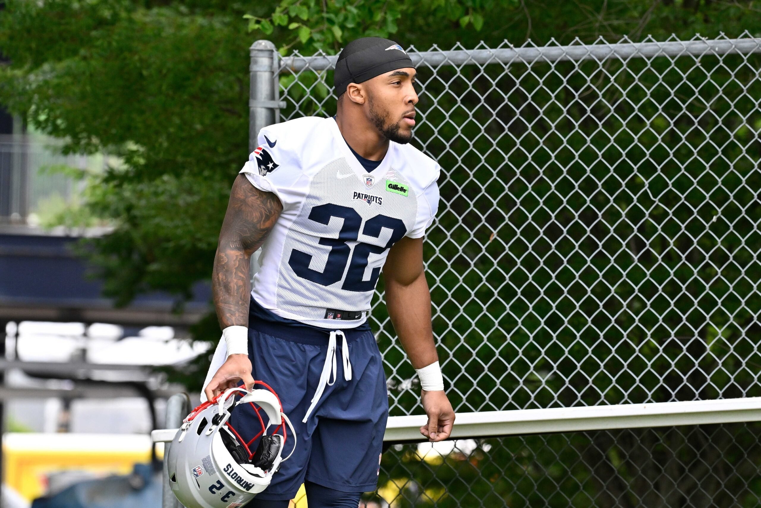 Jun 9, 2025; Foxborough, MA, USA; New England Patriots running back TreVeyon Henderson (32) walks to the practice fields at Gillette Stadium. Mandatory Credit: Eric Canha-Imagn Images
