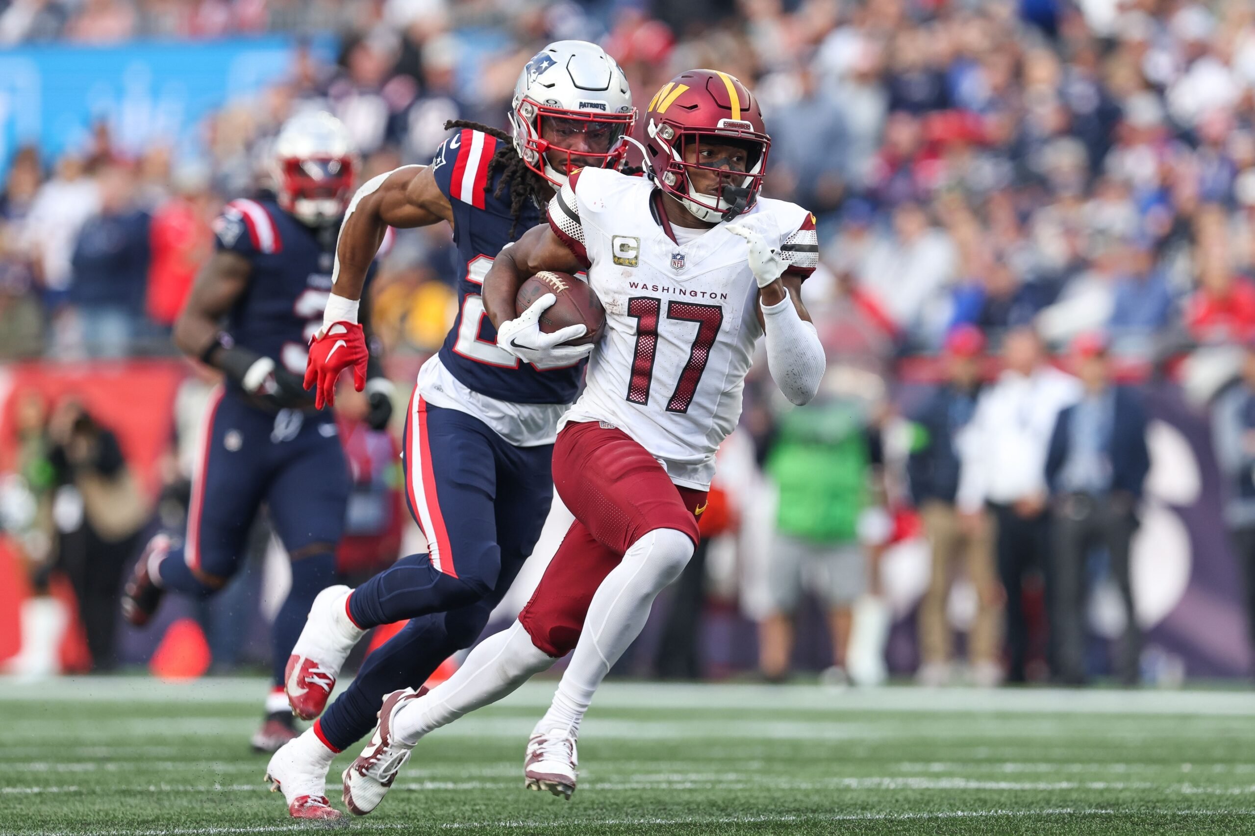 Nov 5, 2023; Foxborough, Massachusetts, USA; Washington Commanders receiver Terry McLaurin (17) runs the ball during the second half against the New England Patriots at Gillette Stadium. Mandatory Credit: Paul Rutherford-USA TODAY Sports