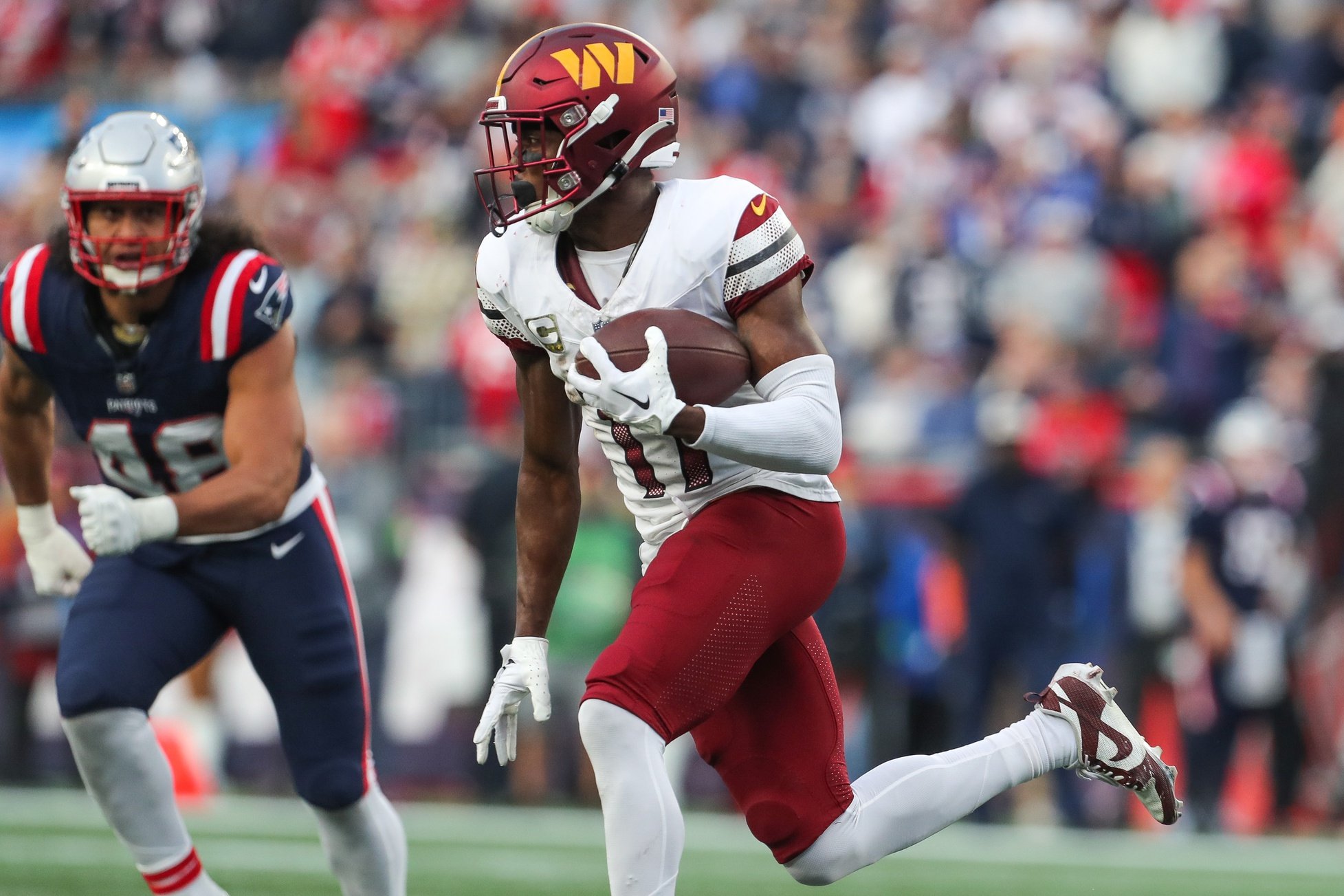 Nov 5, 2023; Foxborough, Massachusetts, USA; Washington Commanders receiver Terry McLaurin (17) runs the ball during the second half against the New England Patriots at Gillette Stadium. Mandatory Credit: Paul Rutherford-USA TODAY Sports