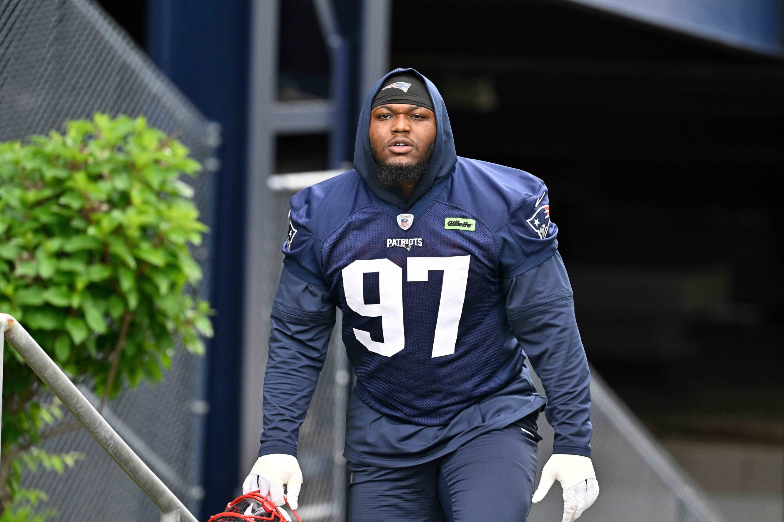 Jun 9, 2025; Foxborough, MA, USA; New England Patriots defensive end Milton Williams (97) walks to the practice fields at Gillette Stadium. Mandatory Credit: Eric Canha-Imagn Images