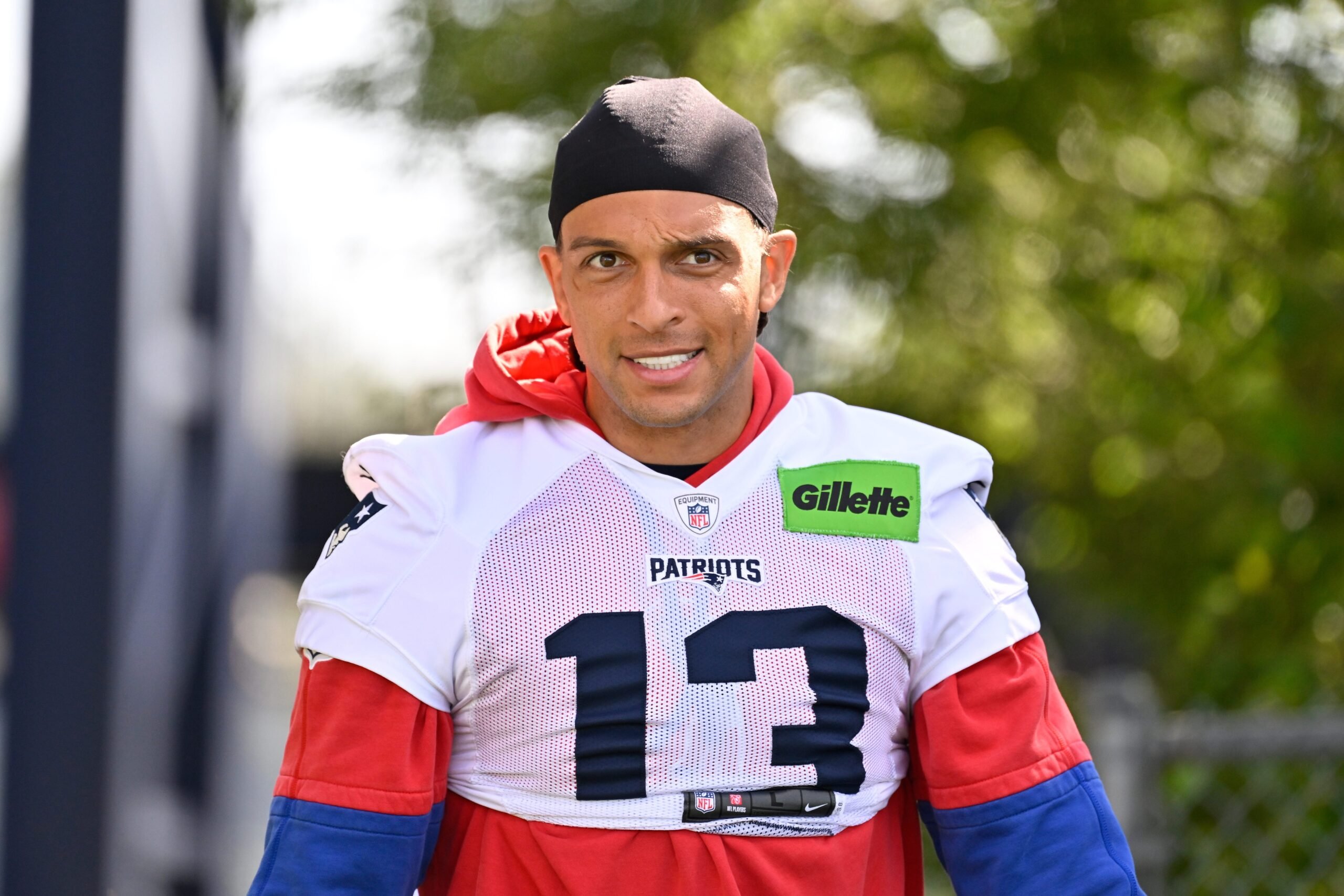 Jul 23, 2025; Foxborough, MA, USA; New England Patriots wide receiver Mack Hollins (13) heads to the practice field for day one of training camp at Gillette Stadium. Mandatory Credit: Eric Canha-Imagn Images