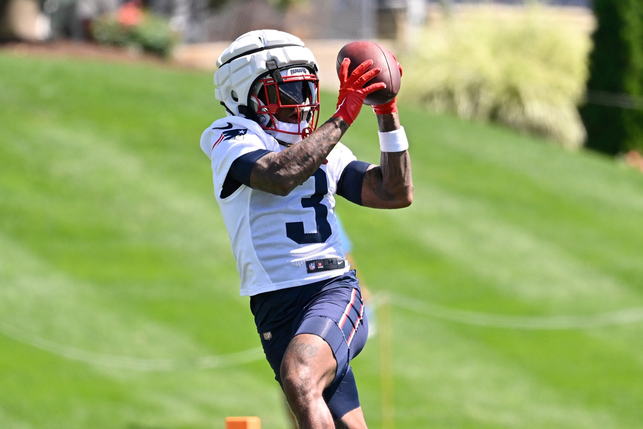 Jul 23, 2025; Foxborough, MA, USA; New England Patriots wide receiver DeMario Douglas (3) makes a catch during training camp at Gillette Stadium. Mandatory Credit: Eric Canha-Imagn Images