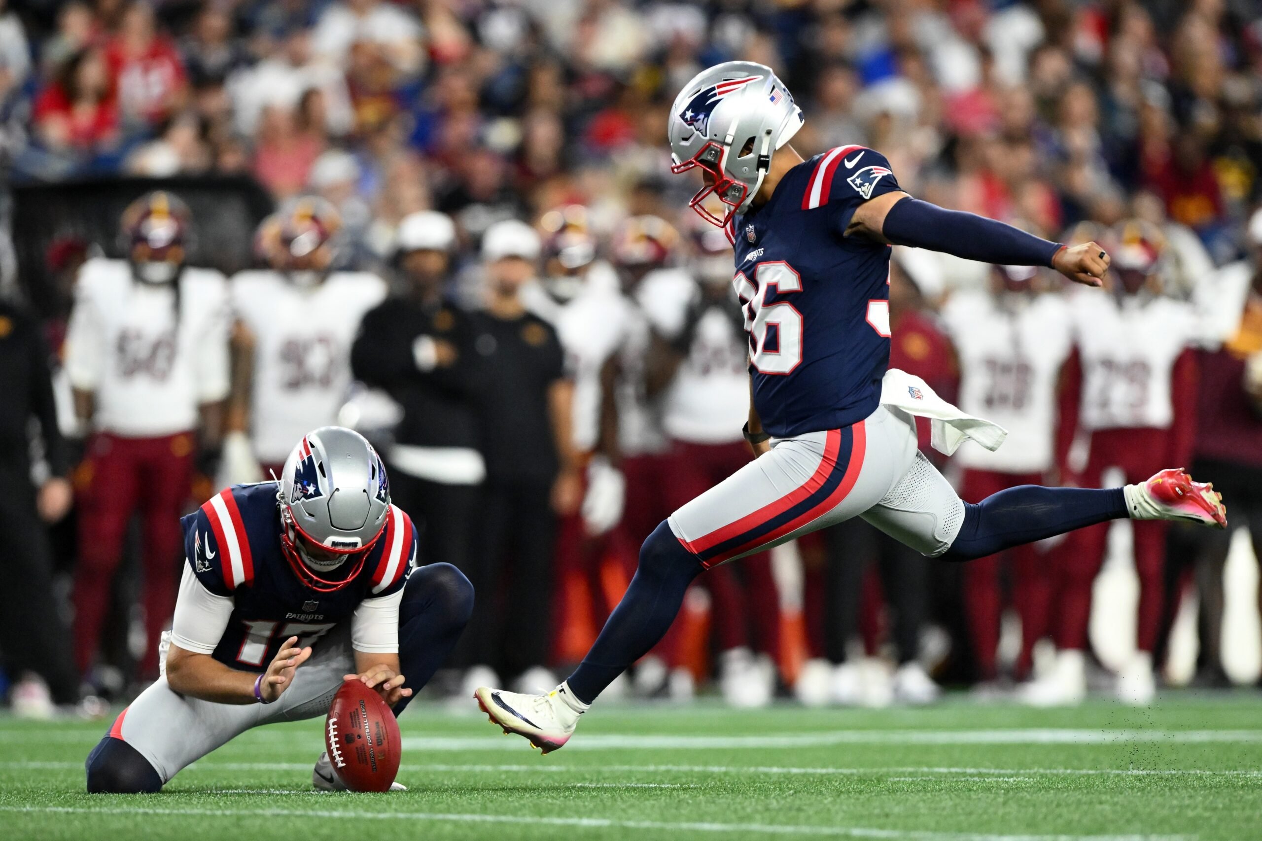 Aug 8, 2025; Foxborough, Massachusetts, USA; New England Patriots place kicker Andy Borregales (36) kicks the ball against the Washington Commanders during the first half at Gillette Stadium. Mandatory Credit: Brian Fluharty-Imagn Images