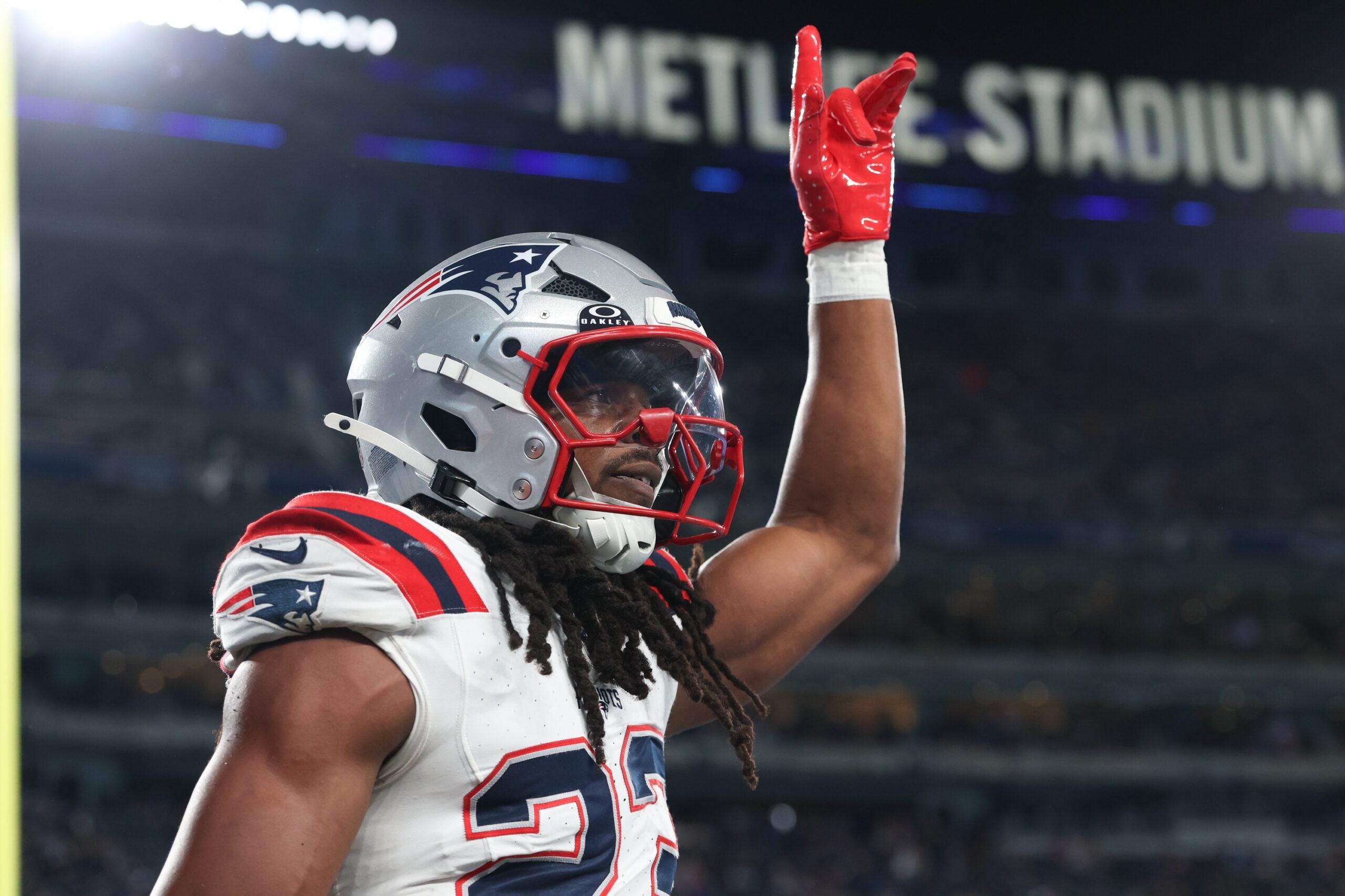 Aug 21, 2025; East Rutherford, New Jersey, USA; New England Patriots safety Kyle Dugger (23) reacts after intercepting a pass during the first half against the New York Giants at MetLife Stadium. Mandatory Credit: Vincent Carchietta-Imagn Images