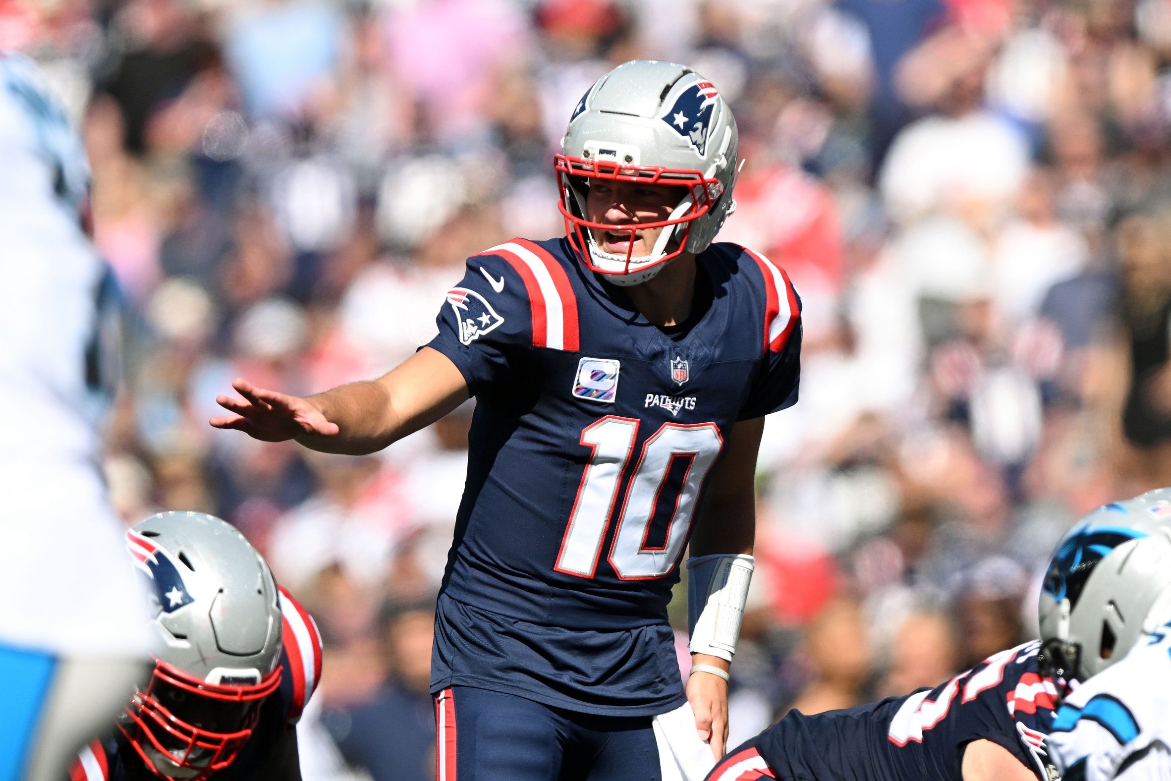 Sep 28, 2025; Foxborough, Massachusetts, USA; New England Patriots quarterback Drake Maye (10) calls a play against the Carolina Panthers  during the first half at Gillette Stadium. Mandatory Credit: Brian Fluharty-Imagn Images