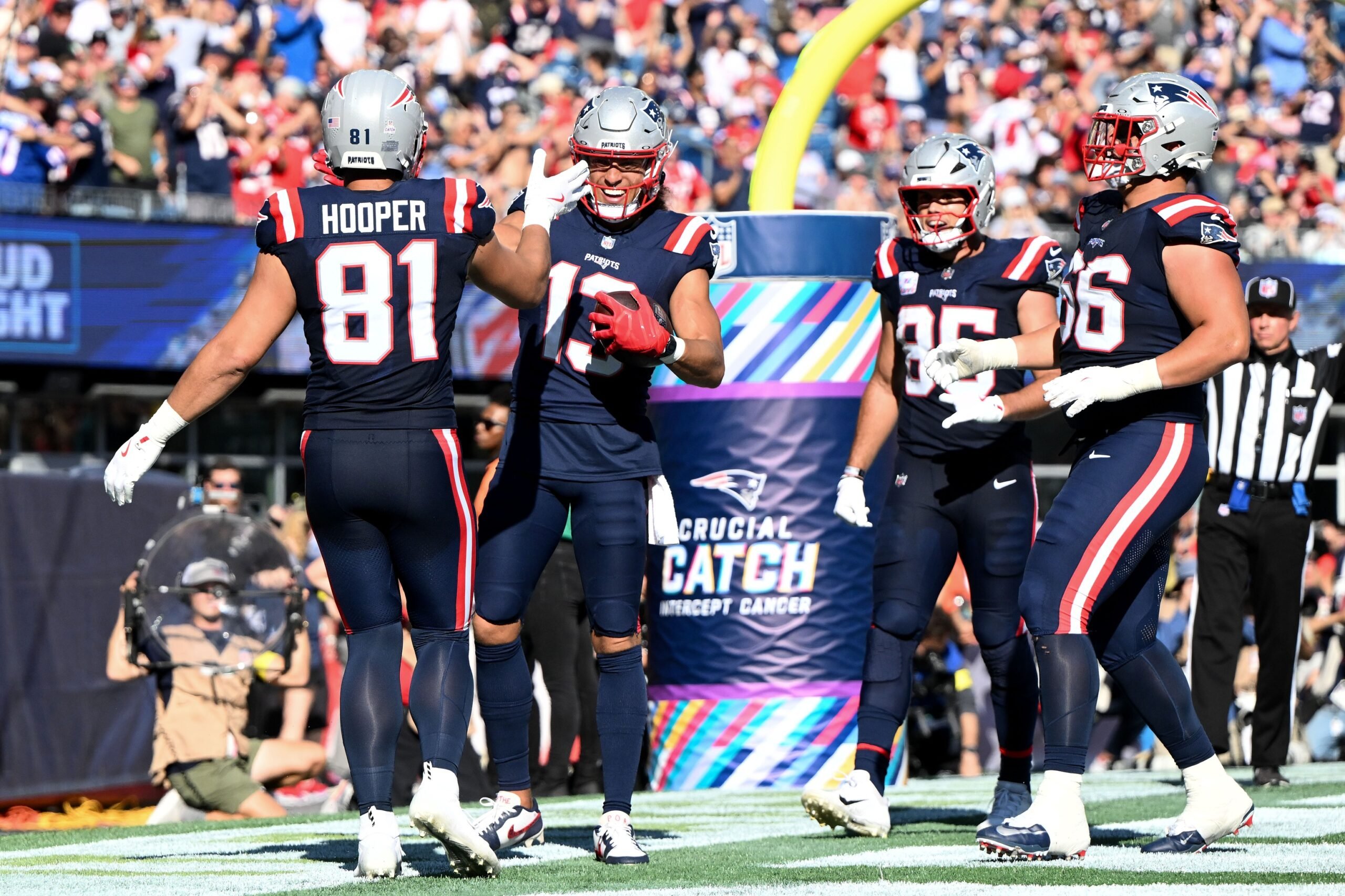 Sep 28, 2025; Foxborough, Massachusetts, USA; New England Patriots wide receiver Mack Hollins (13) celebrates with tight end Austin Hooper (81) after scoring a touchdown against the Carolina Panthers during the second half at Gillette Stadium. Mandatory Credit: Brian Fluharty-Imagn Images