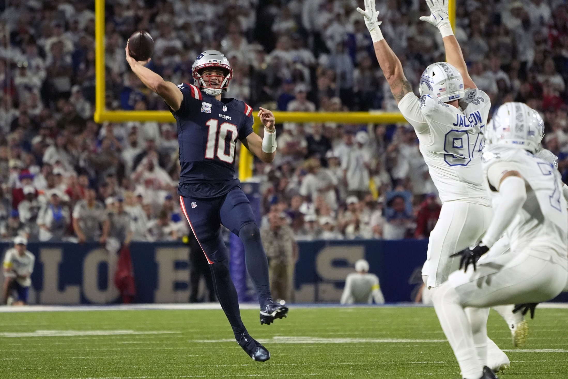 Oct 5, 2025; Orchard Park, New York, USA; New England Patriots quarterback Drake Maye (10) drops back to pass against the Buffalo Bills during the second half at Highmark Stadium. Mandatory Credit: Gregory Fisher-Imagn Images