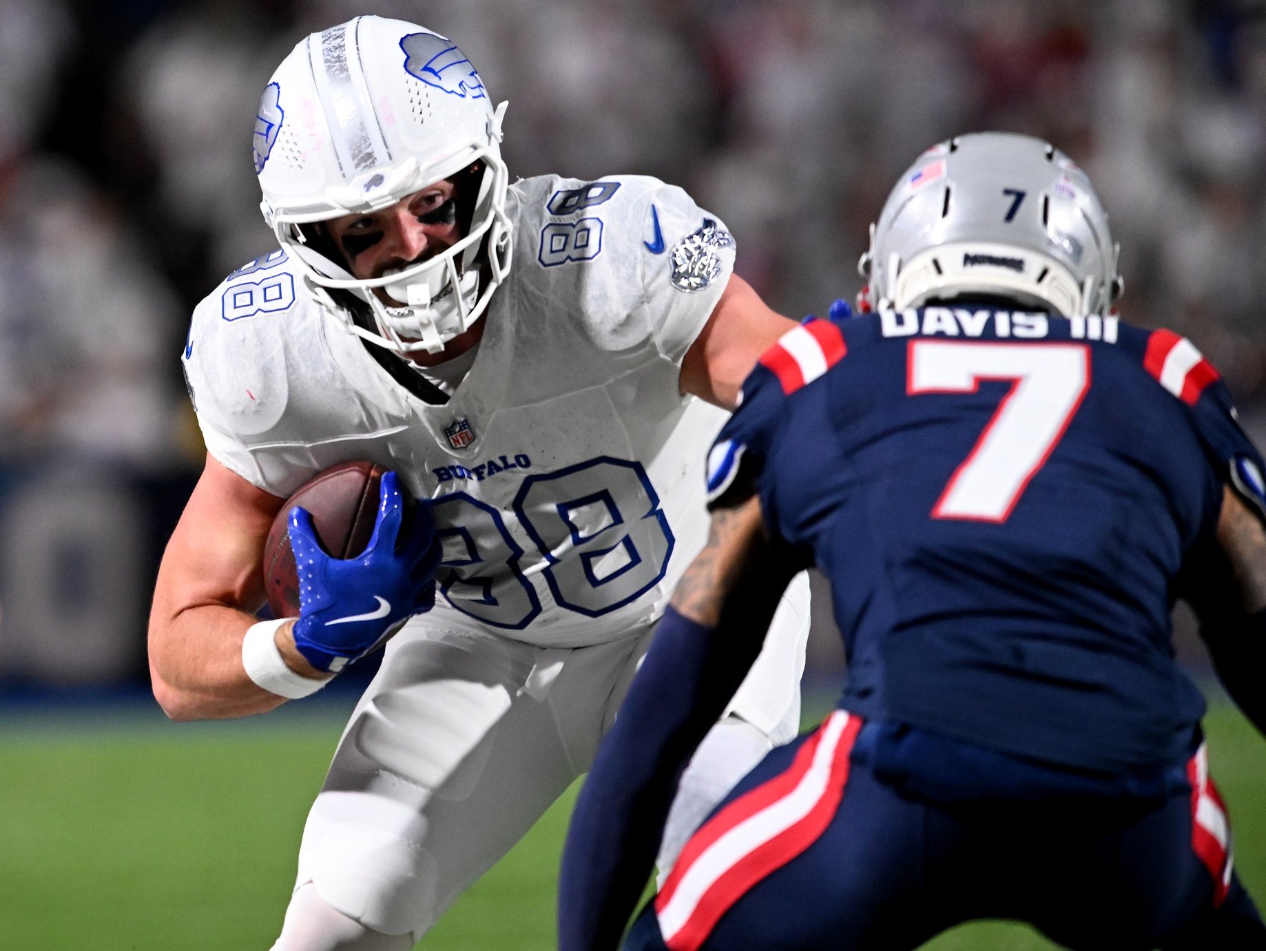 Oct 5, 2025; Orchard Park, New York, USA; Buffalo Bills tight end Dawson Knox (88) makes a catch over New England Patriots cornerback Carlton Davis III (7) during the second half at Highmark Stadium. Mandatory Credit: Mark Konezny-Imagn Images