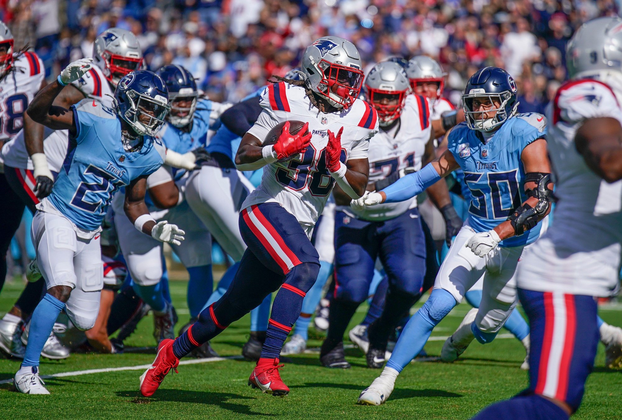 New England Patriots running back Rhamondre Stevenson (38) runs in a touchdown against the Tennessee Titans during the third quarter at Nissan Stadium in Nashville, Tenn., Sunday, Oct. 19, 2025.