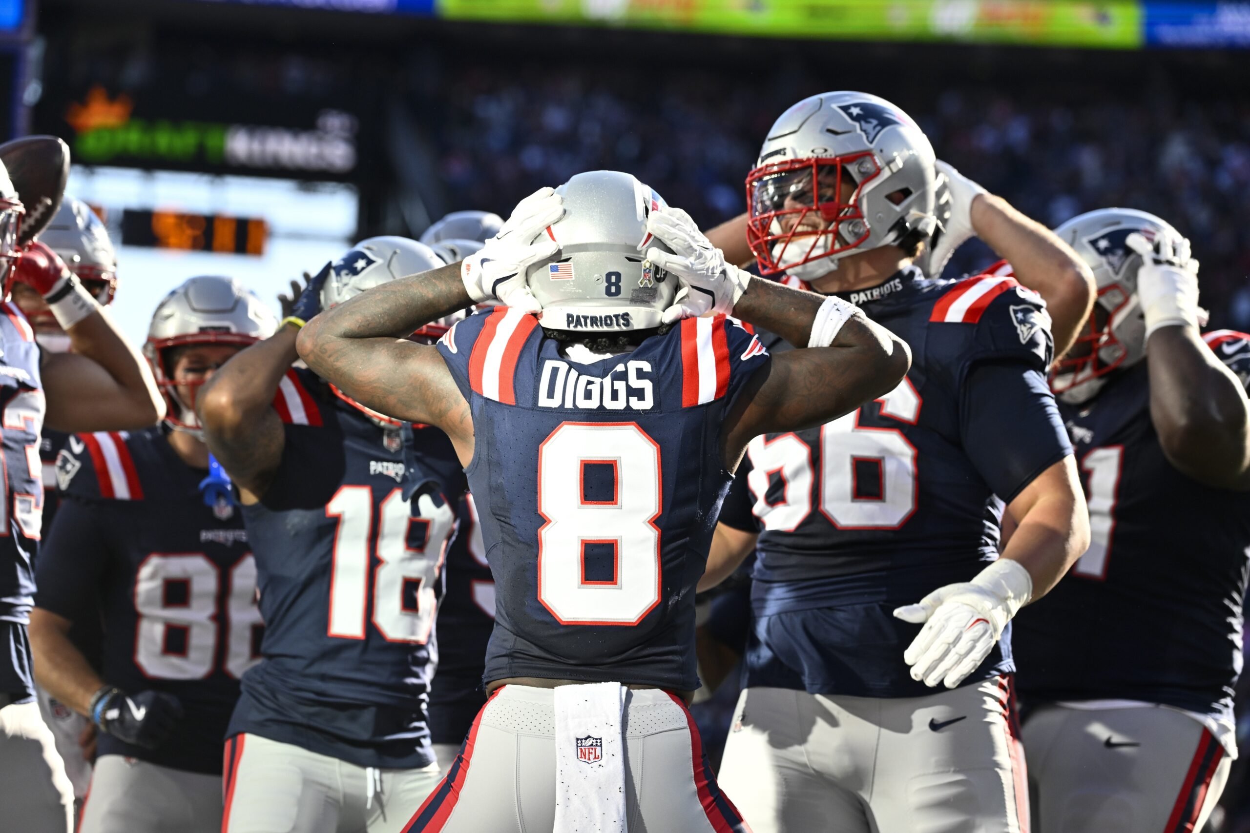 Nov 2, 2025; Foxborough, Massachusetts, USA;  New England Patriots wide receiver Stefon Diggs (8) celebrates his touchdown against the Atlanta Falcons with teammates during the first half at Gillette Stadium. Mandatory Credit: Eric Canha-Imagn Images