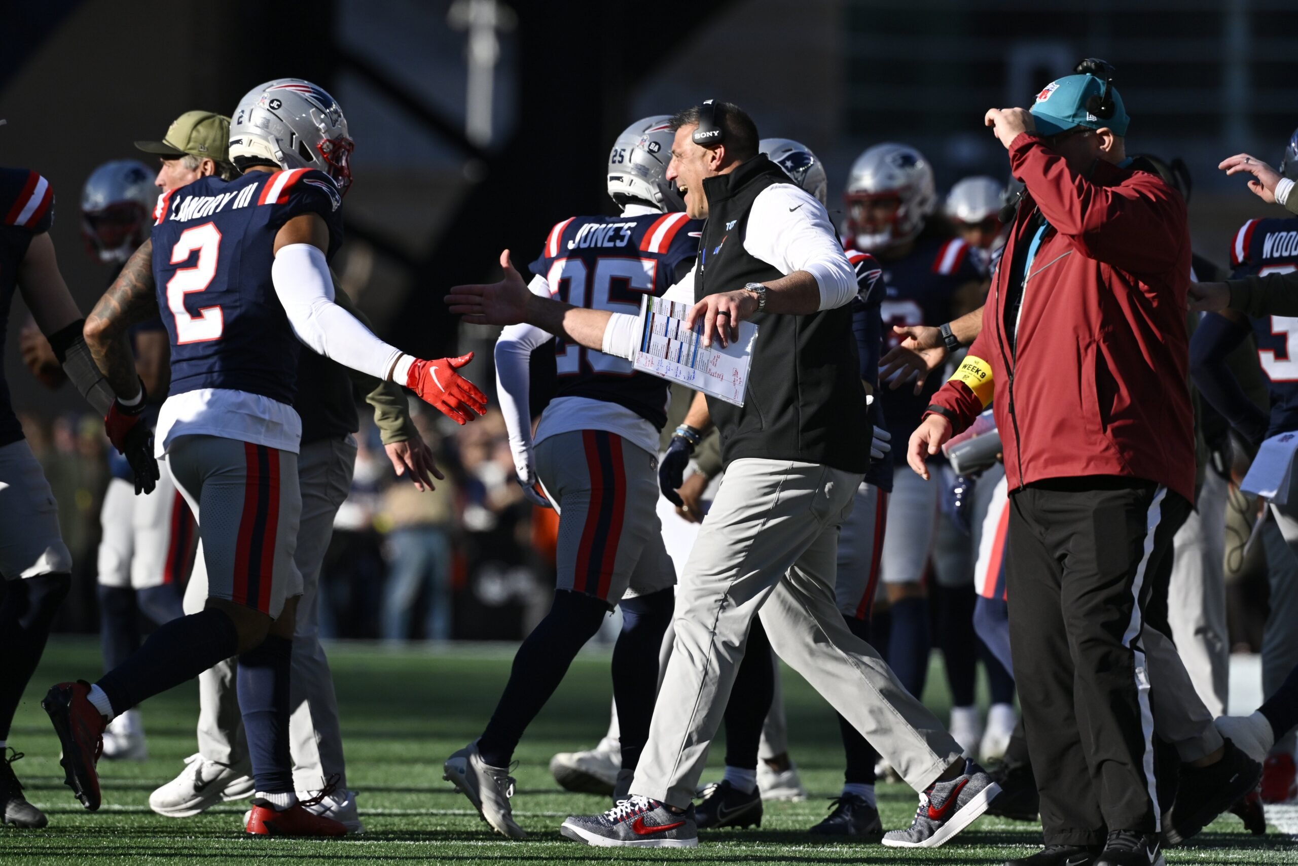 Nov 2, 2025; Foxborough, Massachusetts, USA;  New England Patriots head coach Mike Vrabel high fives linebacker Harold Landry III (2) during the first half against the Atlanta Falcons at Gillette Stadium. Mandatory Credit: Eric Canha-Imagn Images