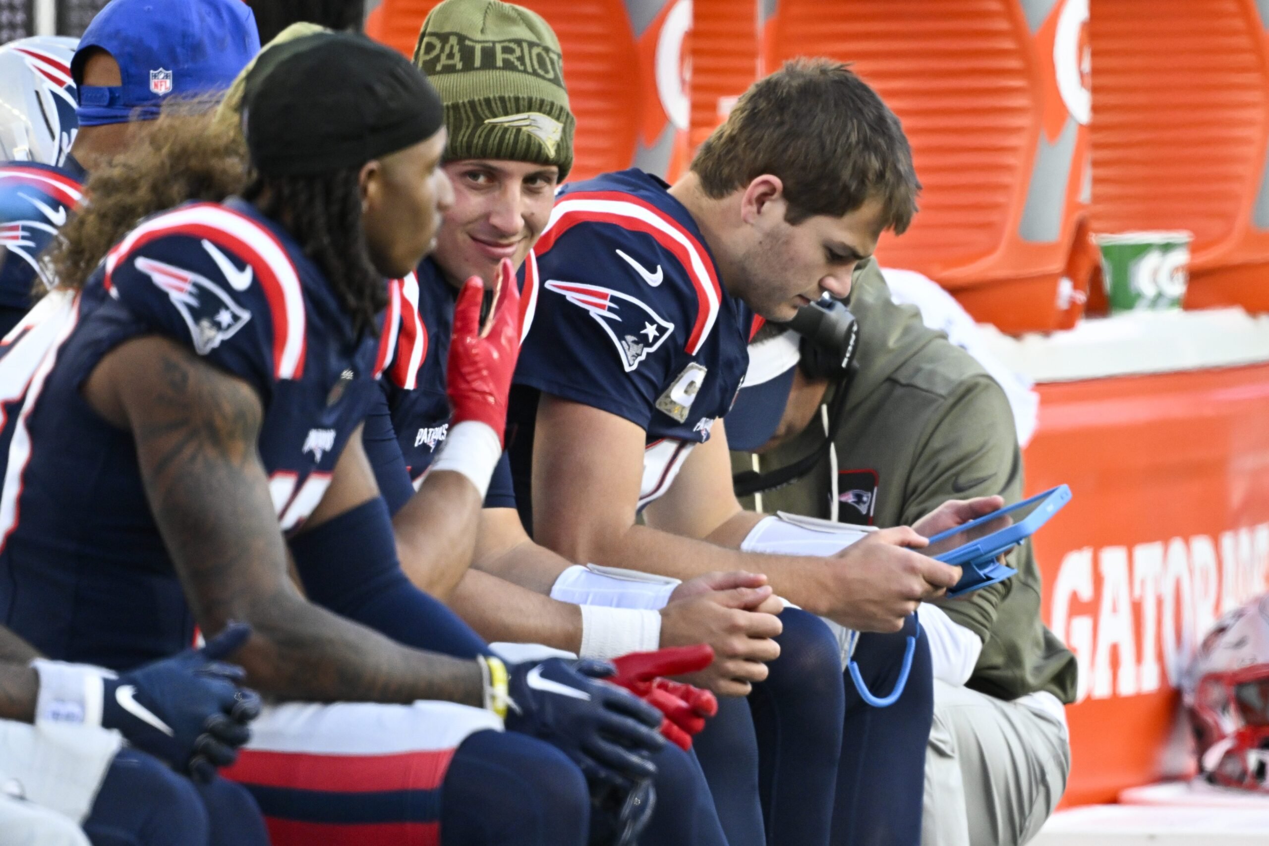 Nov 2, 2025; Foxborough, Massachusetts, USA; New England Patriots quarterback Drake Maye (10) studies a tablet during the second half against the Atlanta Falcons at Gillette Stadium. Mandatory Credit: Eric Canha-Imagn Images