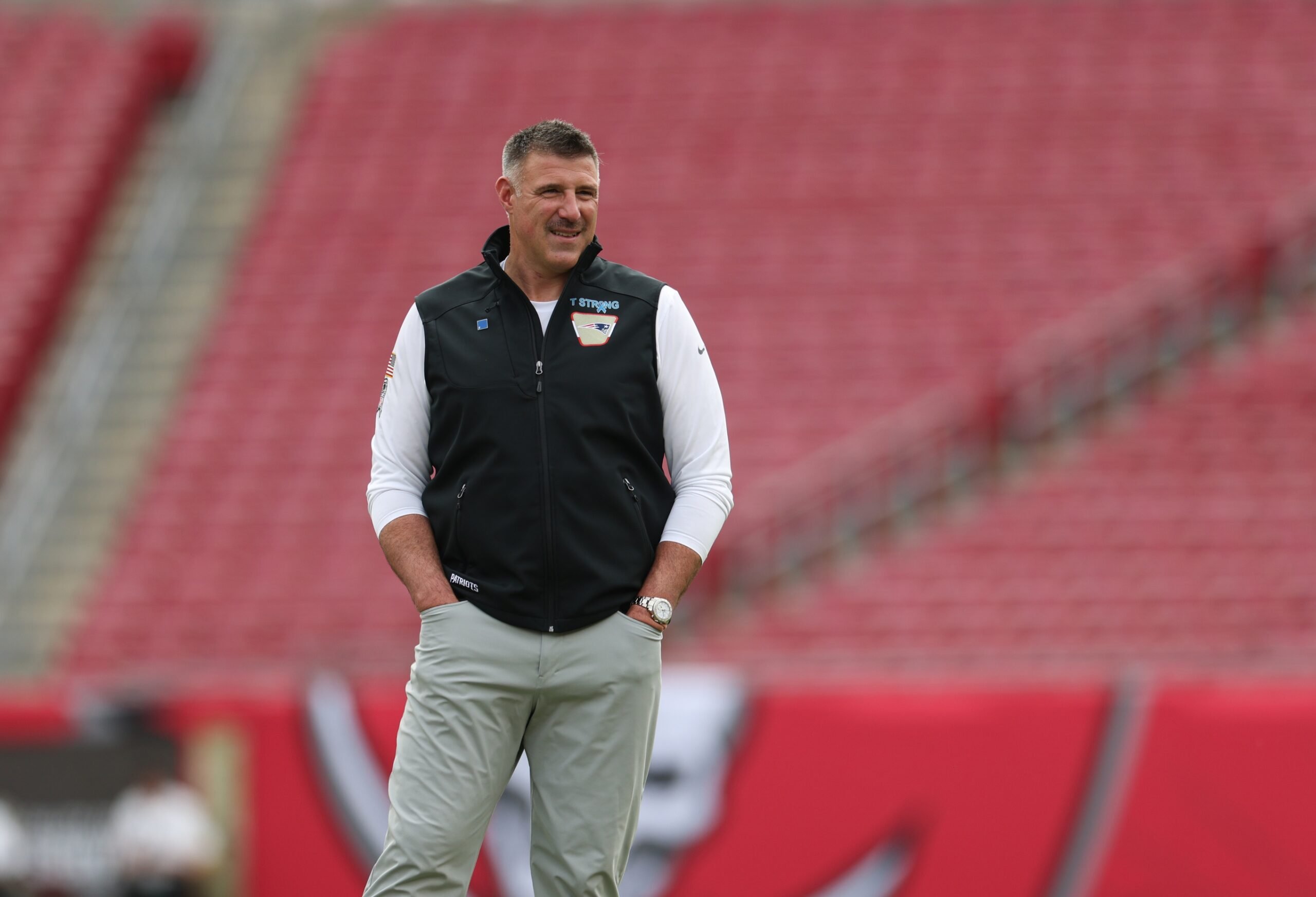 Nov 9, 2025; Tampa, Florida, USA; New England Patriots head coach Mike Vrabel walks the field prior to a game against the Tampa Bay Buccaneers at Raymond James Stadium. Mandatory Credit: Nathan Ray Seebeck-Imagn Images