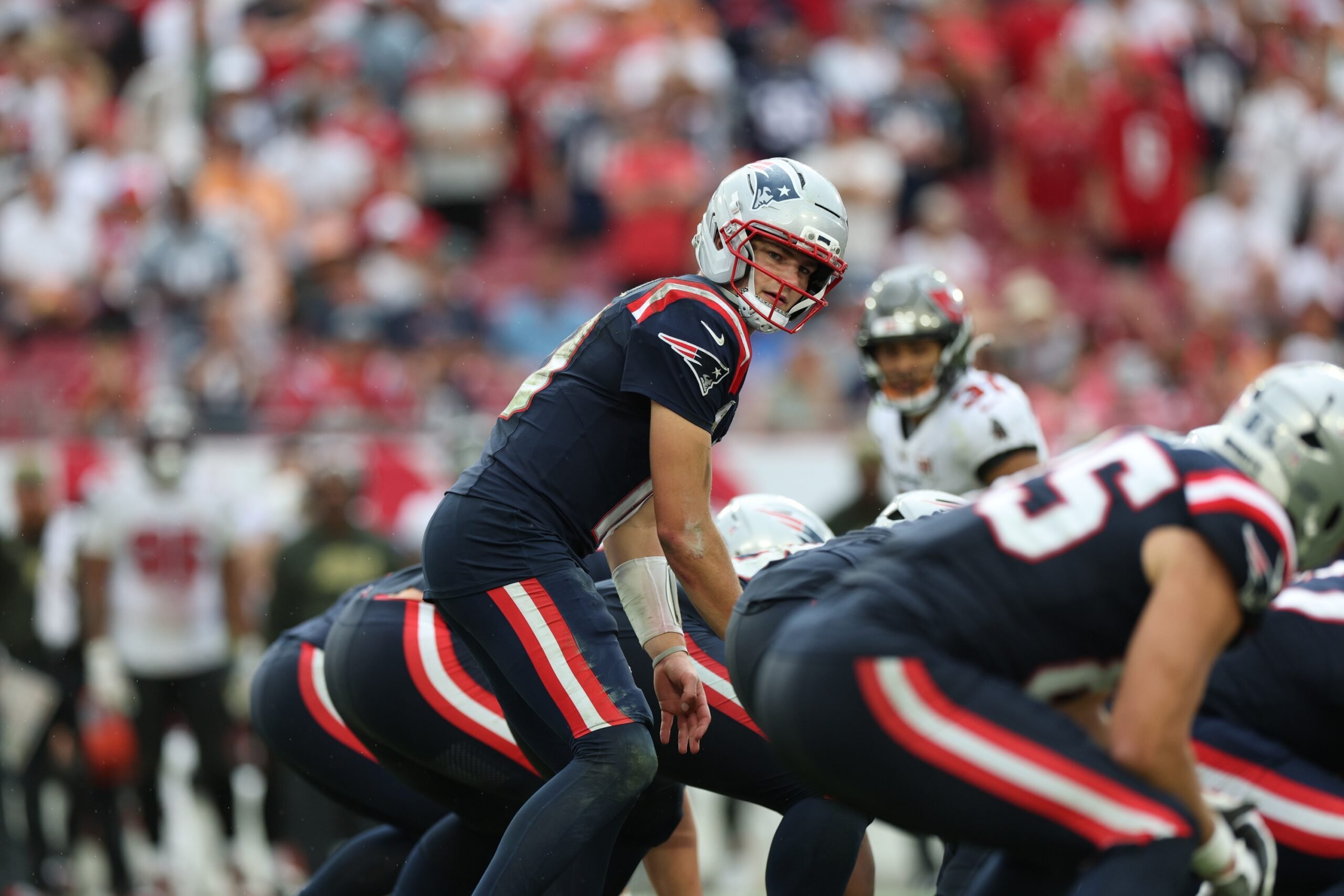 Nov 9, 2025; Tampa, Florida, USA; New England Patriots quarterback Drake Maye (10) under center during the fourth quarter against the Tampa Bay Buccaneers at Raymond James Stadium. Mandatory Credit: Nathan Ray Seebeck-Imagn Images