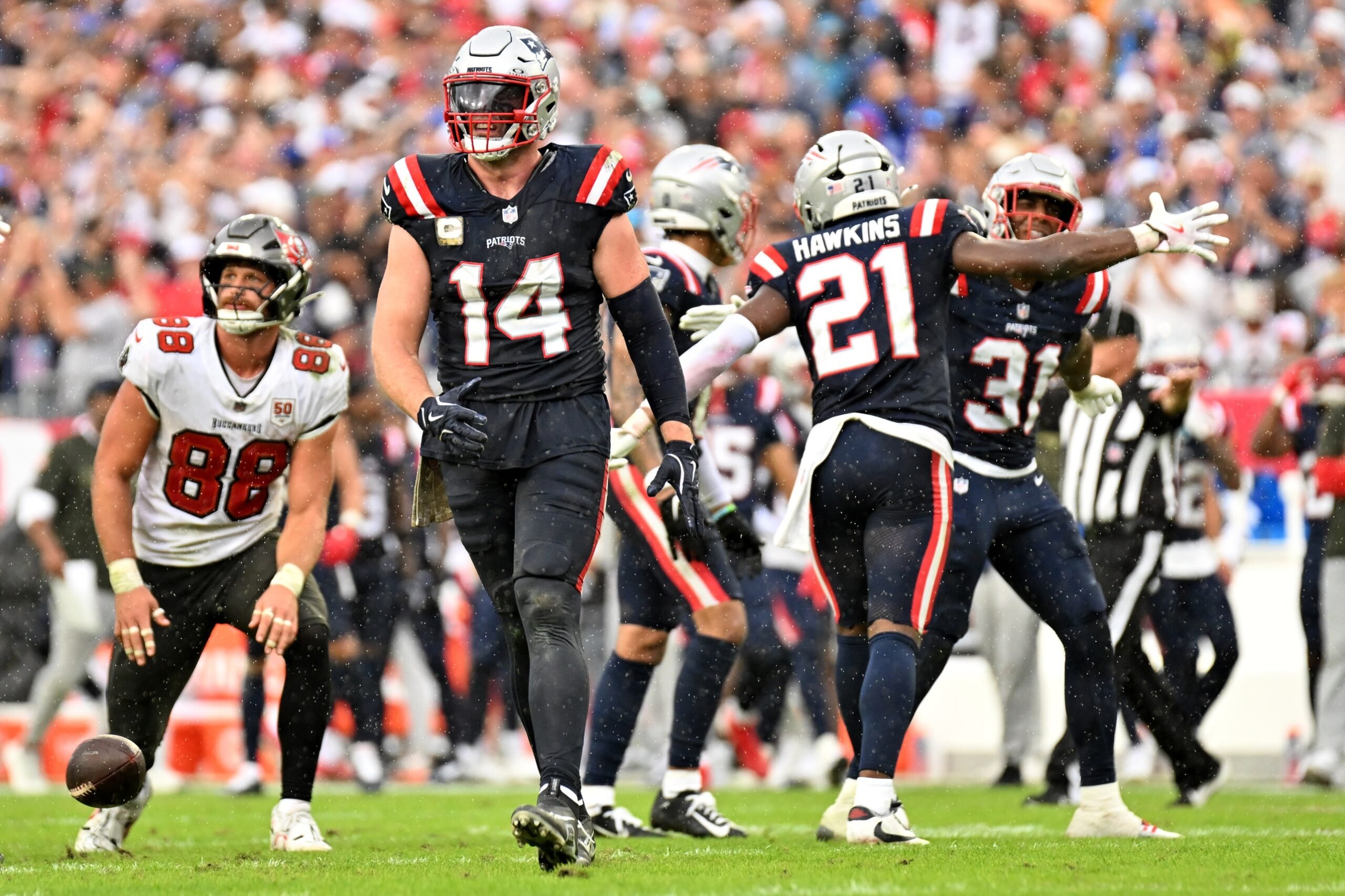 Nov 9, 2025; Tampa, Florida, USA; New England Patriots linebacker Robert Spillane (14) walks upfield during the fourth quarter against the Tampa Bay Buccaneers at Raymond James Stadium. Mandatory Credit: Jonathan Dyer-Imagn Images