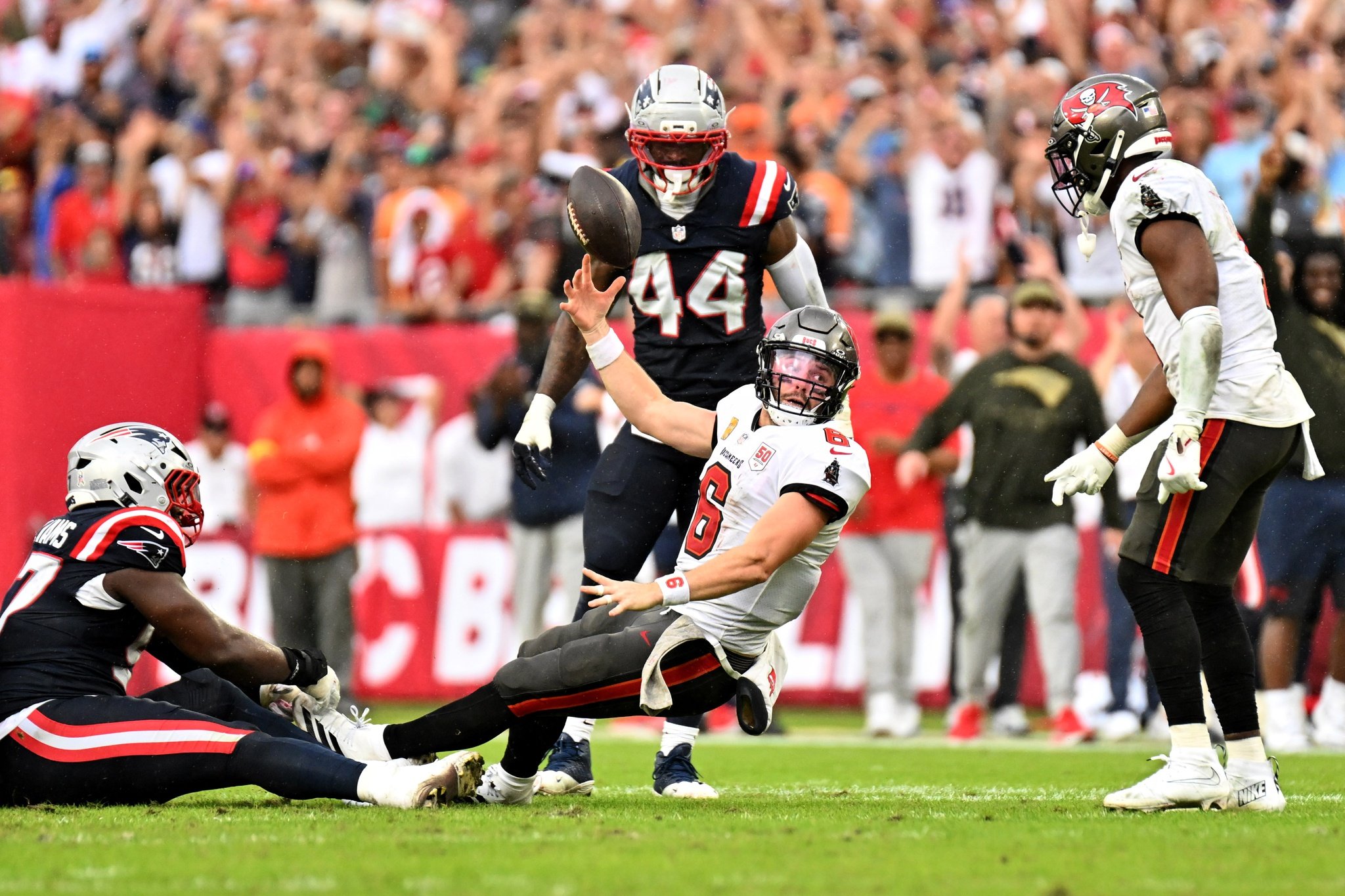 Nov 9, 2025; Tampa, Florida, USA; Tampa Bay Buccaneers quarterback Baker Mayfield (6) throws the ball away during the fourth quarter against the New England Patriots at Raymond James Stadium. Mandatory Credit: Jonathan Dyer-Imagn Images