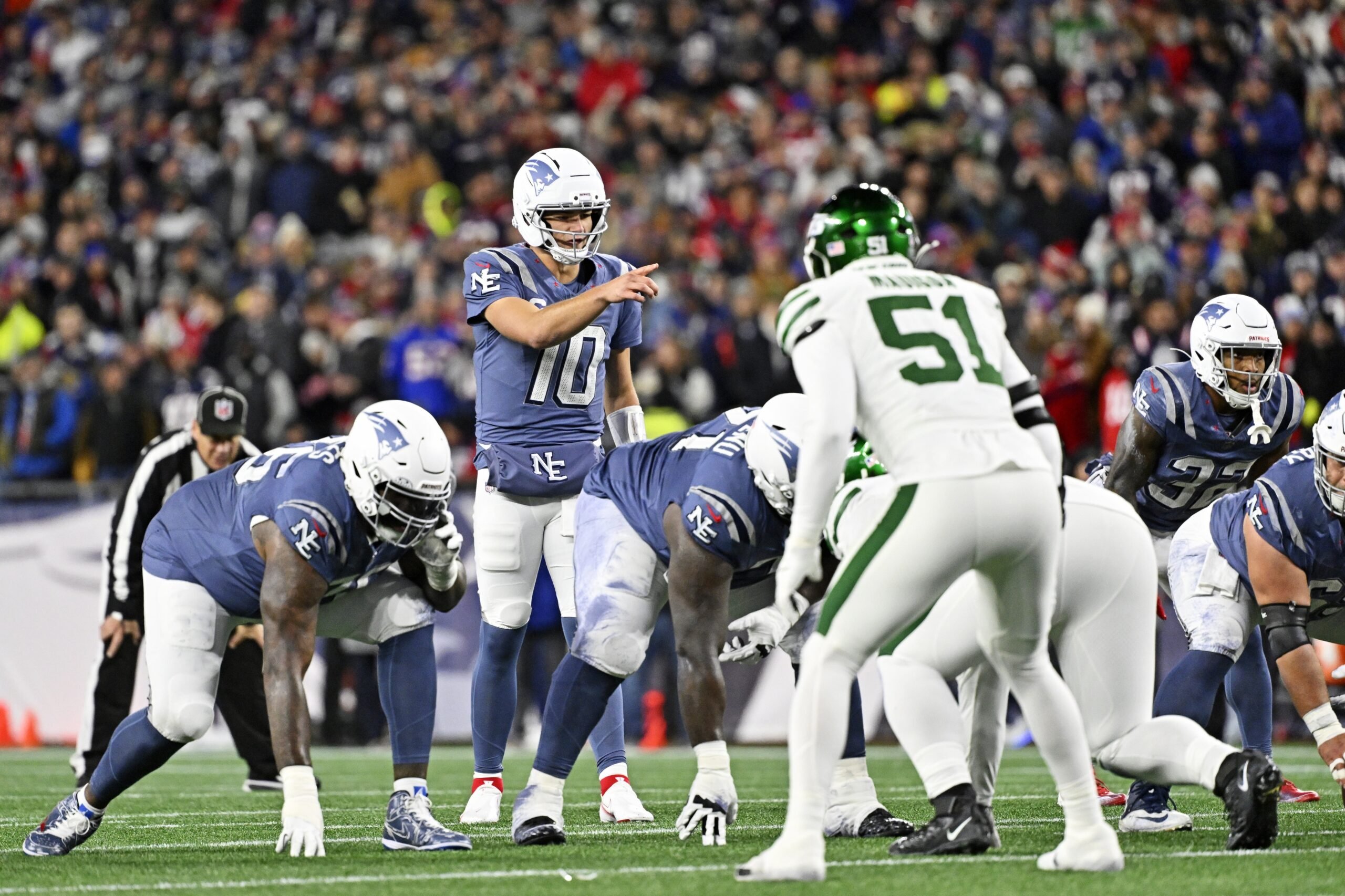 Nov 13, 2025; Foxborough, Massachusetts, USA; New England Patriots quarterback Drake Maye (10) sets up during the first half against the New York Jets at Gillette Stadium. Mandatory Credit: Eric Canha-Imagn Images