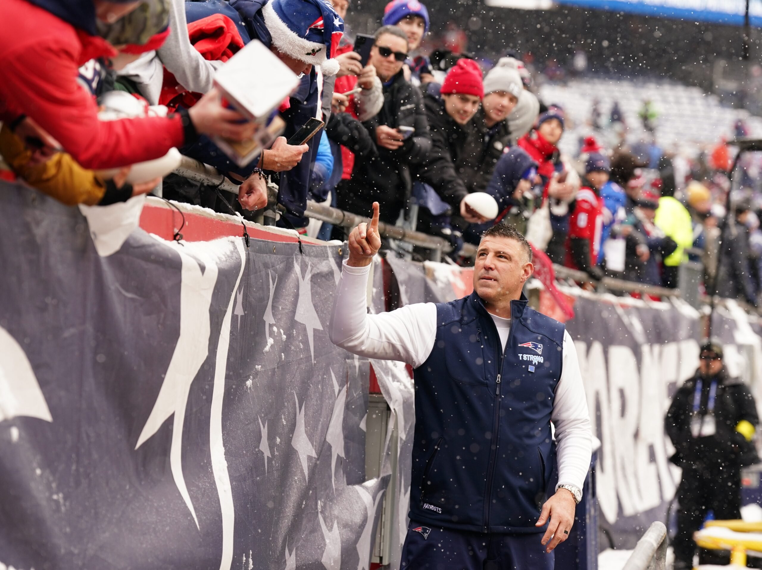 Dec 14, 2025; Foxborough, Massachusetts, USA; New England Patriots head coach Mike Vrabel signs autographs before the start of the game against the Buffalo Bills at Gillette Stadium. Mandatory Credit: David Butler II-Imagn Images